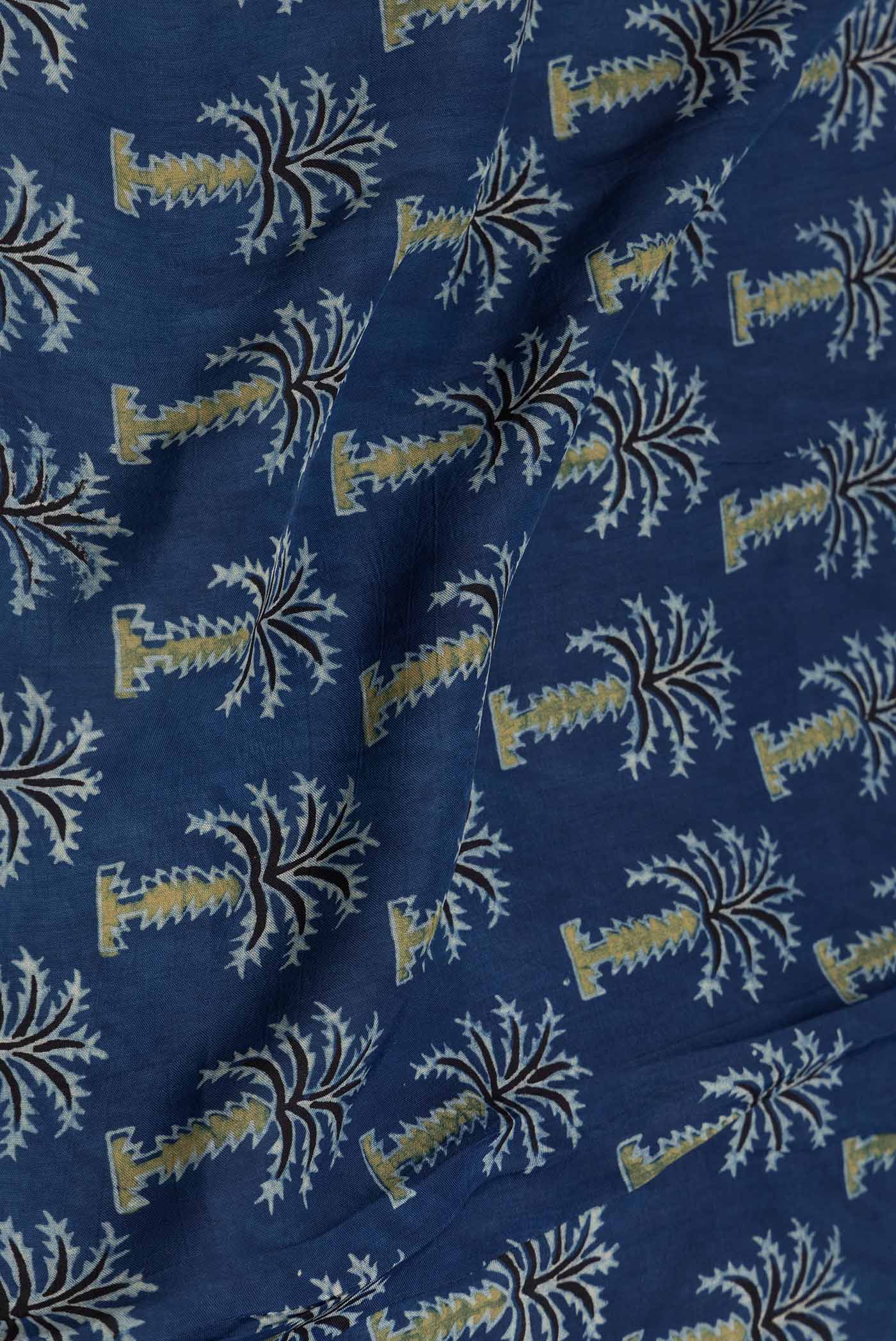 Close up of Navy Blue Dual Tone Satin Silk Saree with Printed design on the body and Zari Border displaying folds