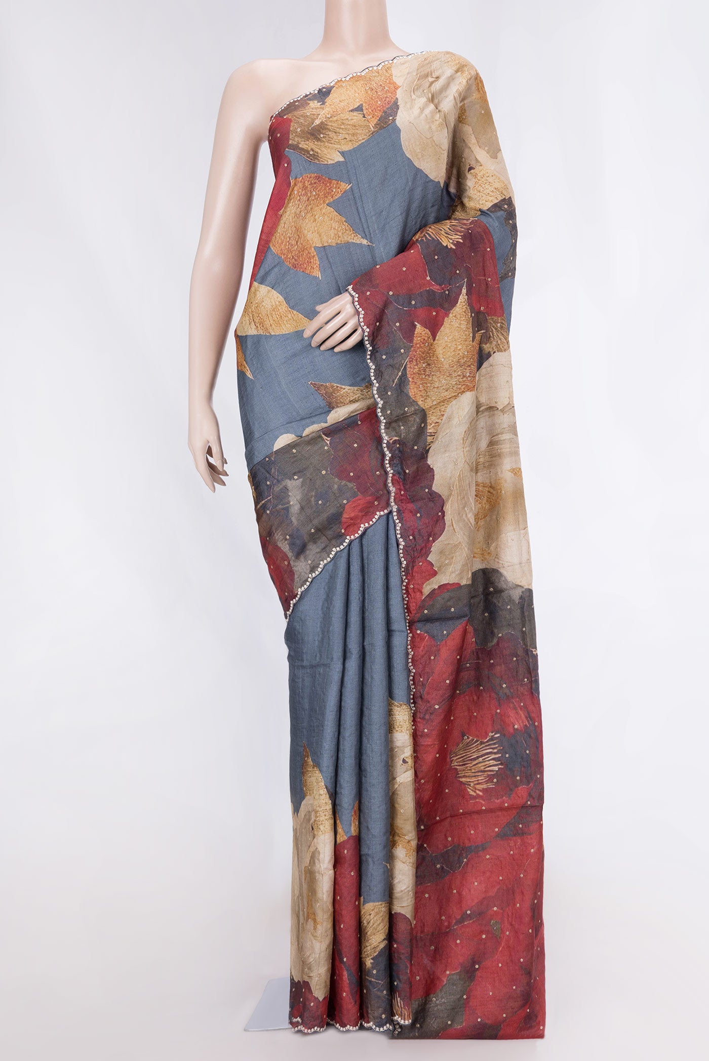 Blue Grey Tussar Silk Saree with Embroidery on the body and Embroidery Border displayed on a mannequin