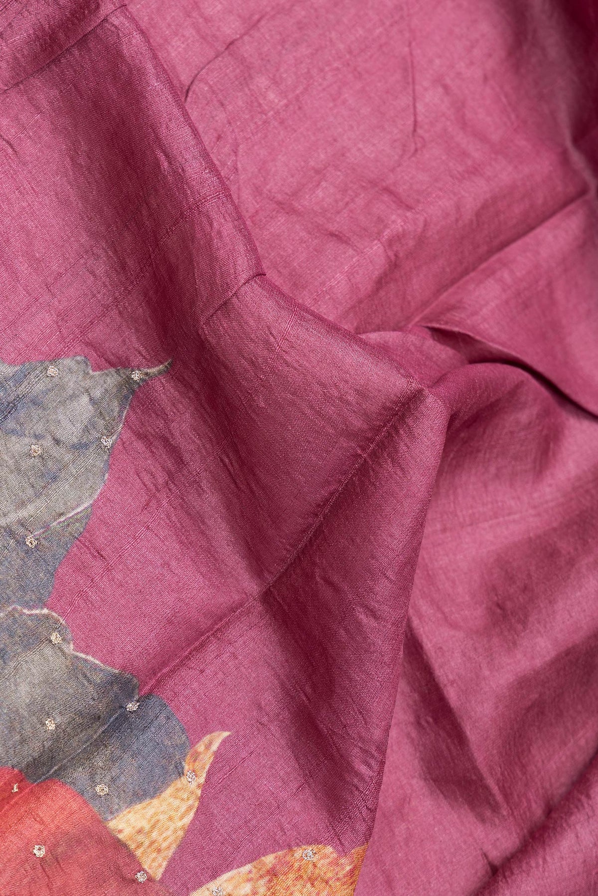 Close up of Pink,Red and Magenta Color Tussar Silk Saree with Embroidery on the body and Embroidery Border.  displaying folds