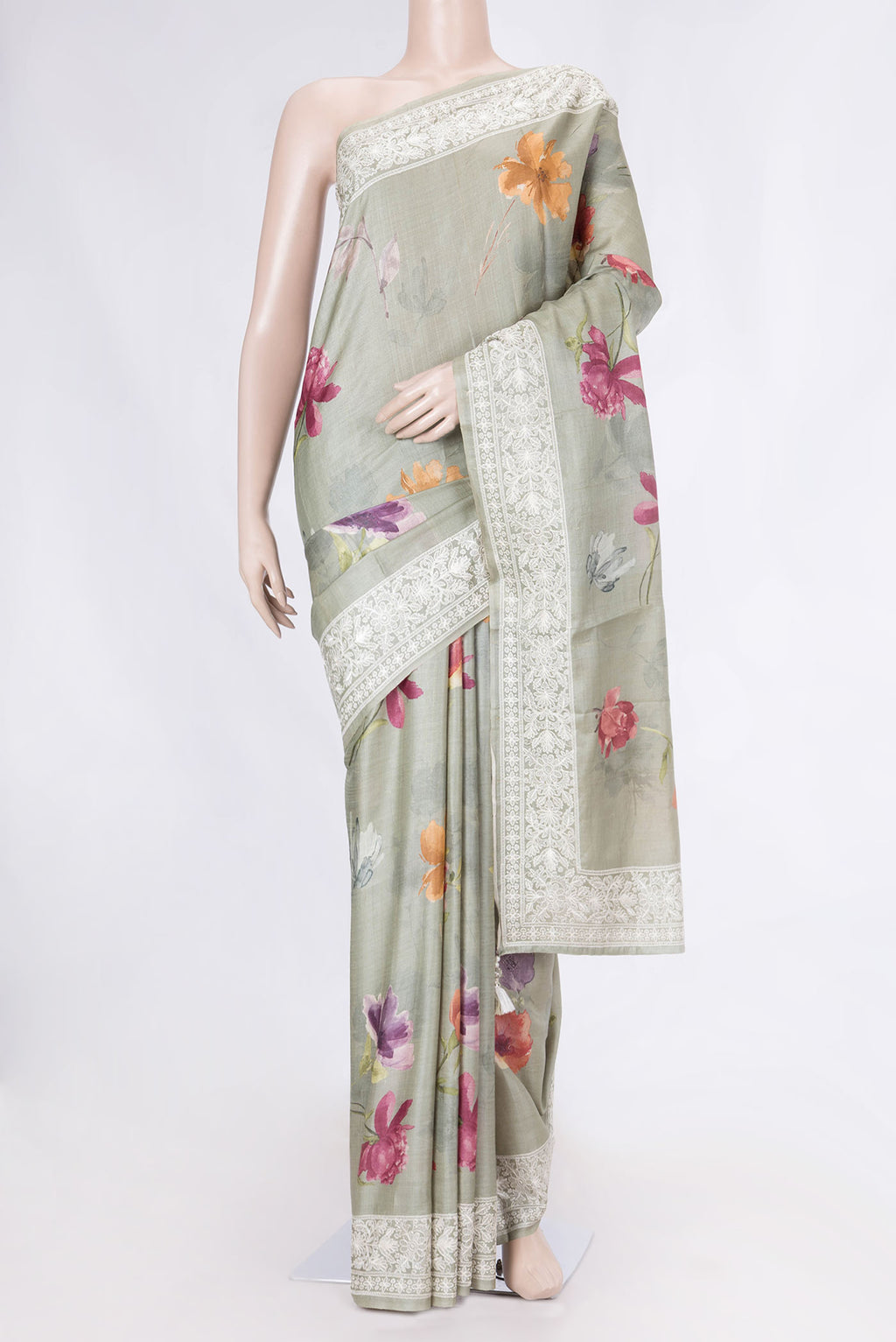 Green Tussar Silk Saree with Floral Print on the body and Embroidery Border displayed on a mannequin