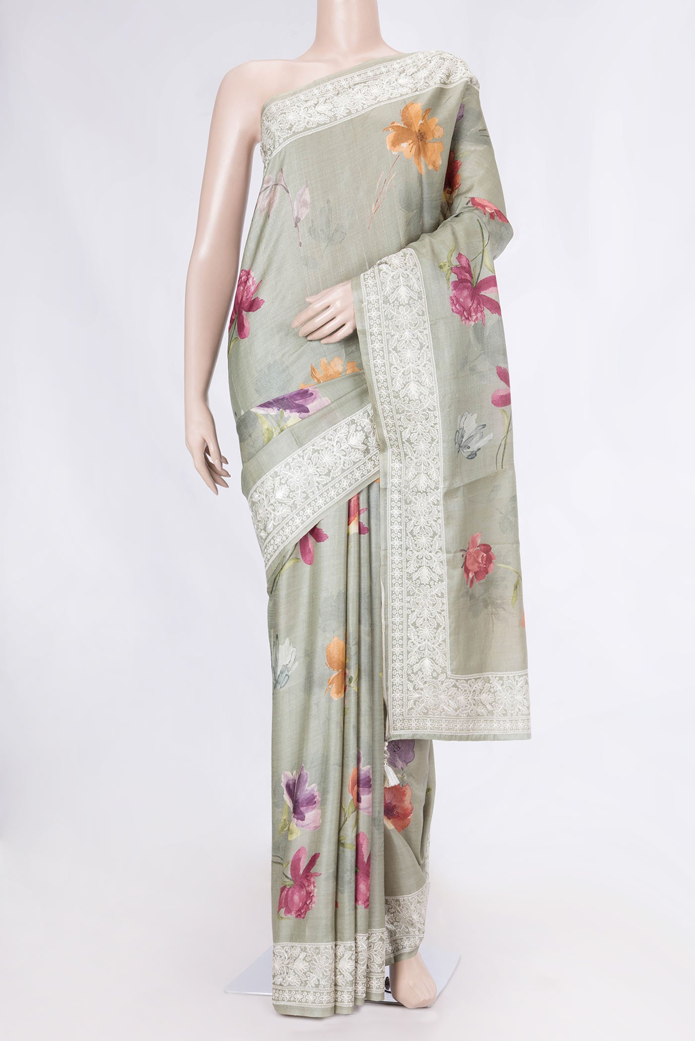 Green Tussar Silk Saree with Floral Print on the body and Embroidery Border displayed on a mannequin
