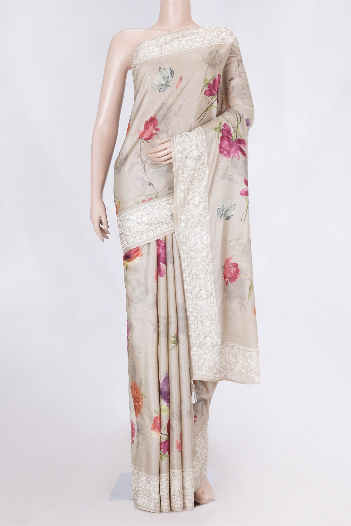 Beige Dual Tone Tussar Saree with Printed design on the body and Embroidery Border displayed on a mannequin