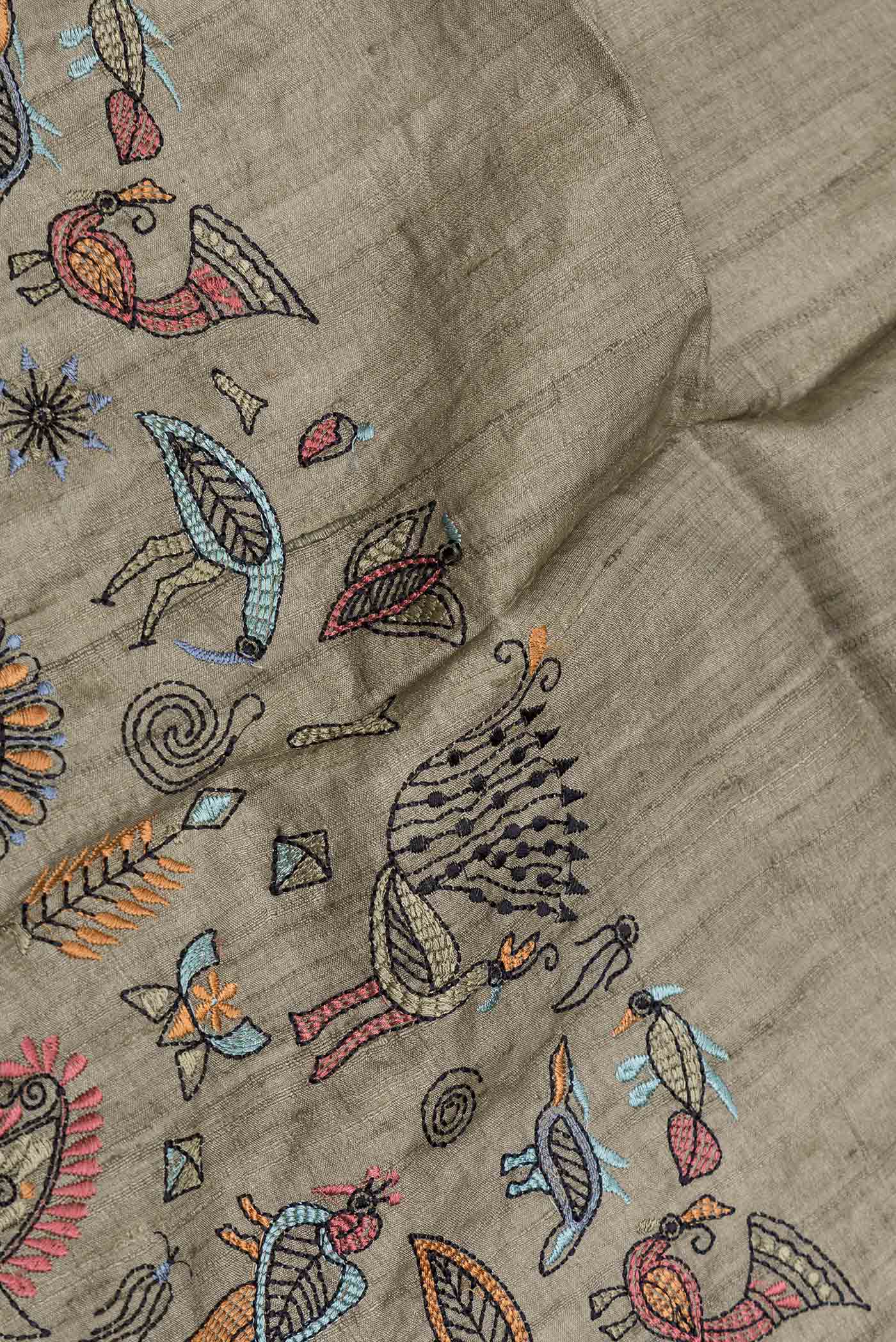 Close up of Mehandi Green Dual Tone Tussar Silk Saree with Embroidery on the body and Embroidery Border displaying folds