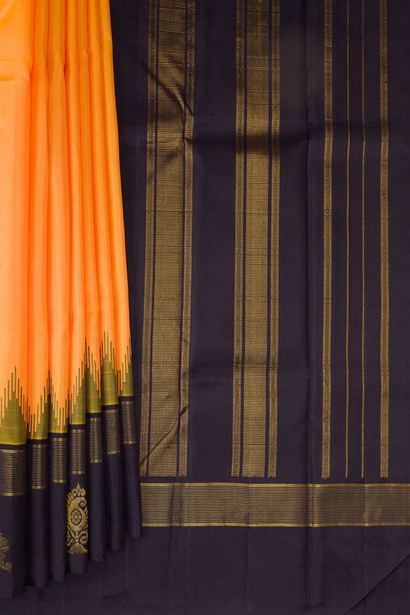 Pleats and pallu of Orange Kanjivaram Silk Saree with Plain Body and Temple Border. 
