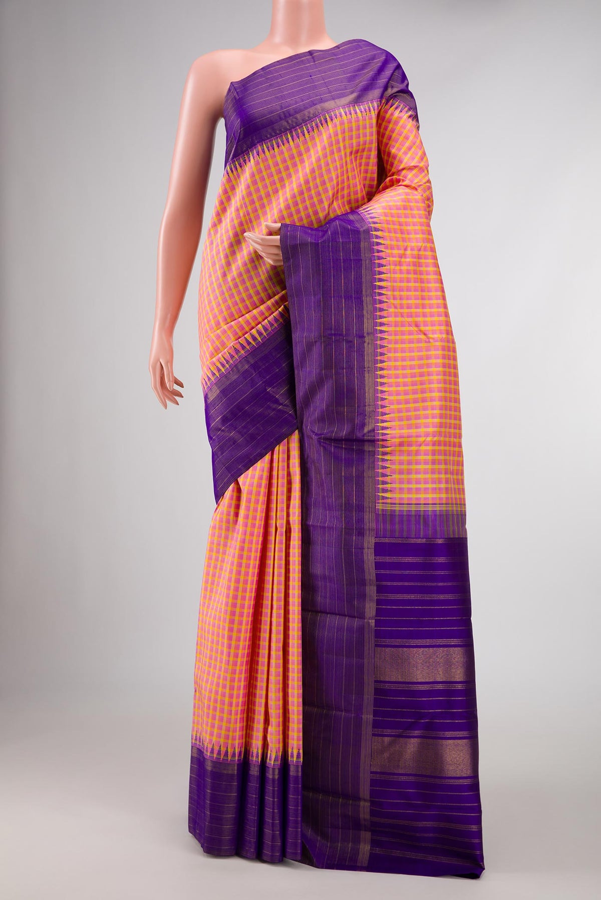 Pure Silk Pure Zari Pink, Purple and Yellow Color Kanchipuram Saree with Checked design on the body and Zari Border displayed on a mannequin