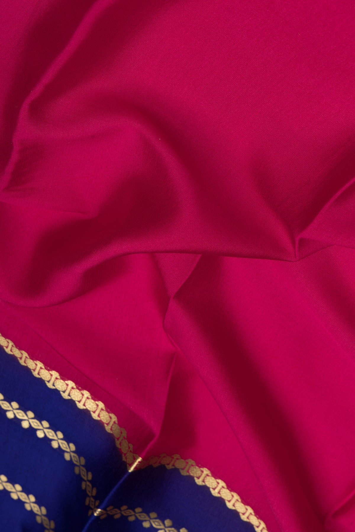 Close up of Pink Dual Tone Mysore Silk Saree with Plain Body and Zari Border.  displaying folds