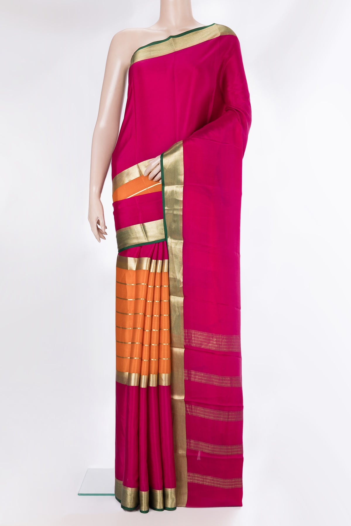 Orange Mysore Crepe Saree with Stripes on the body and Zari Border.  displayed on a mannequin