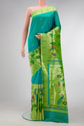Peacock Blue Dual Tone Paithani Silk Saree with Zari Butta on the body and Paithani Border.  displayed on a mannequin