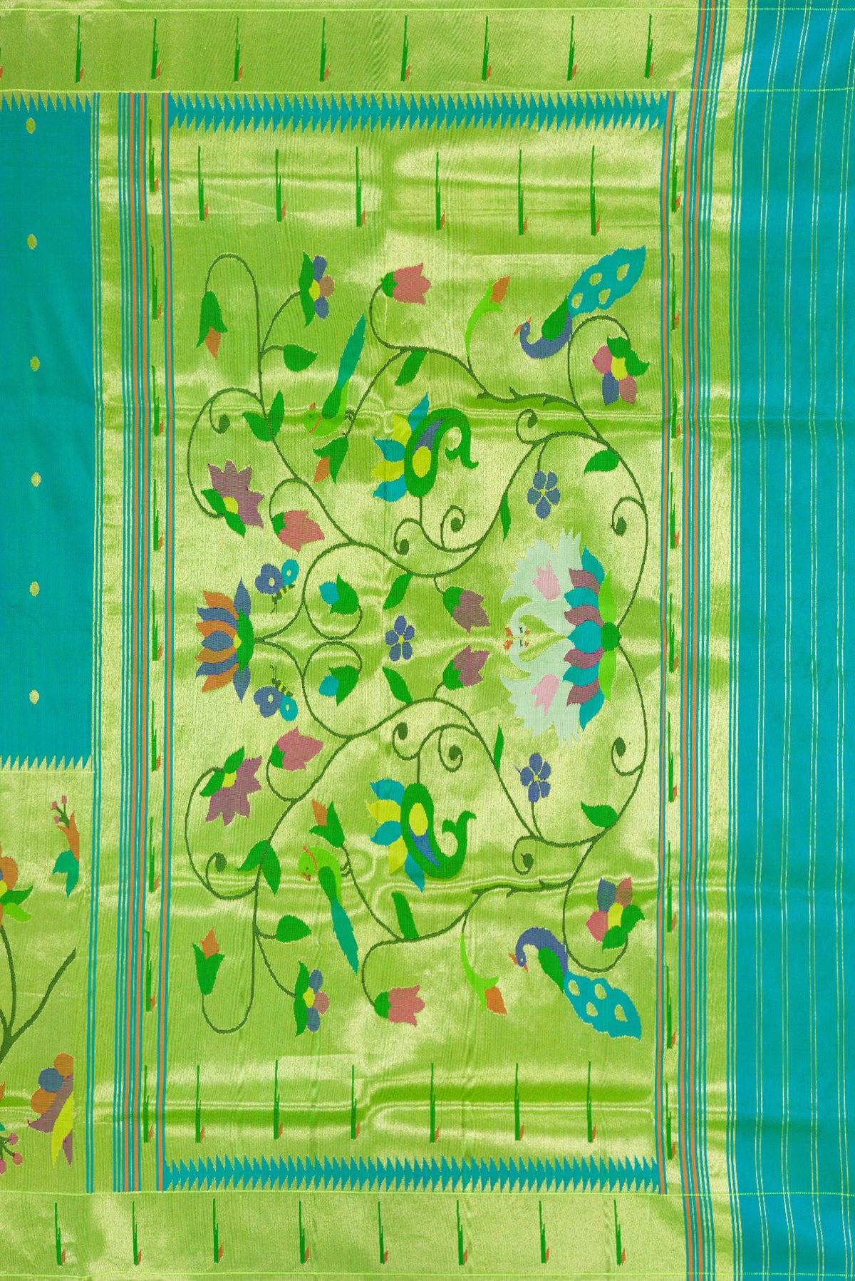 Close up image of the pallu of Peacock Blue Dual Tone Paithani Silk Saree with Zari Butta on the body and Paithani Border. 
