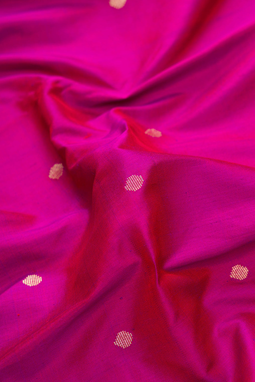 Close up of Purple Dual Tone Paithani Silk Saree with Zari Butta on the body and Paithani Border.  displaying folds