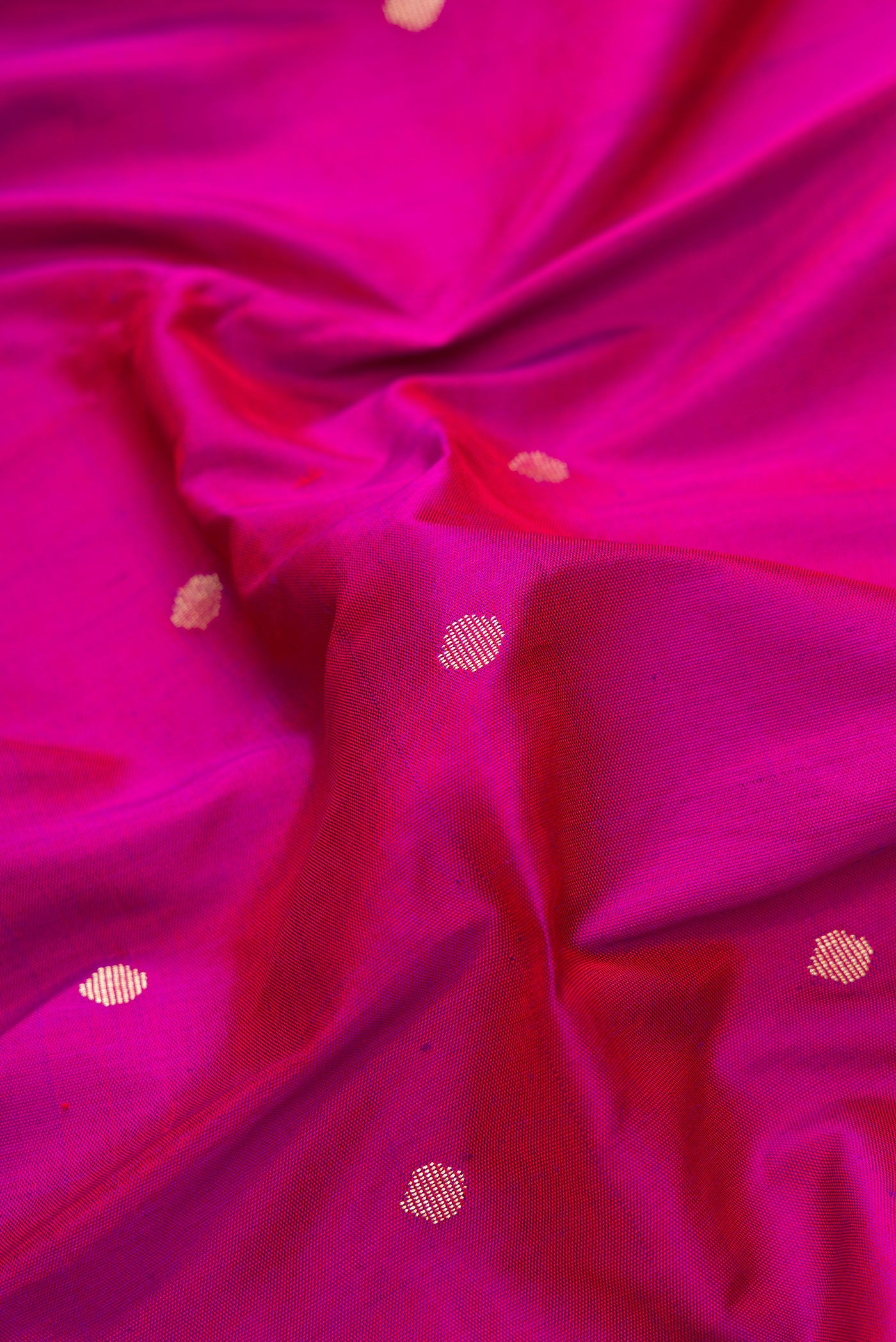 Close up of Purple Dual Tone Paithani Silk Saree with Zari Butta on the body and Paithani Border.  displaying folds