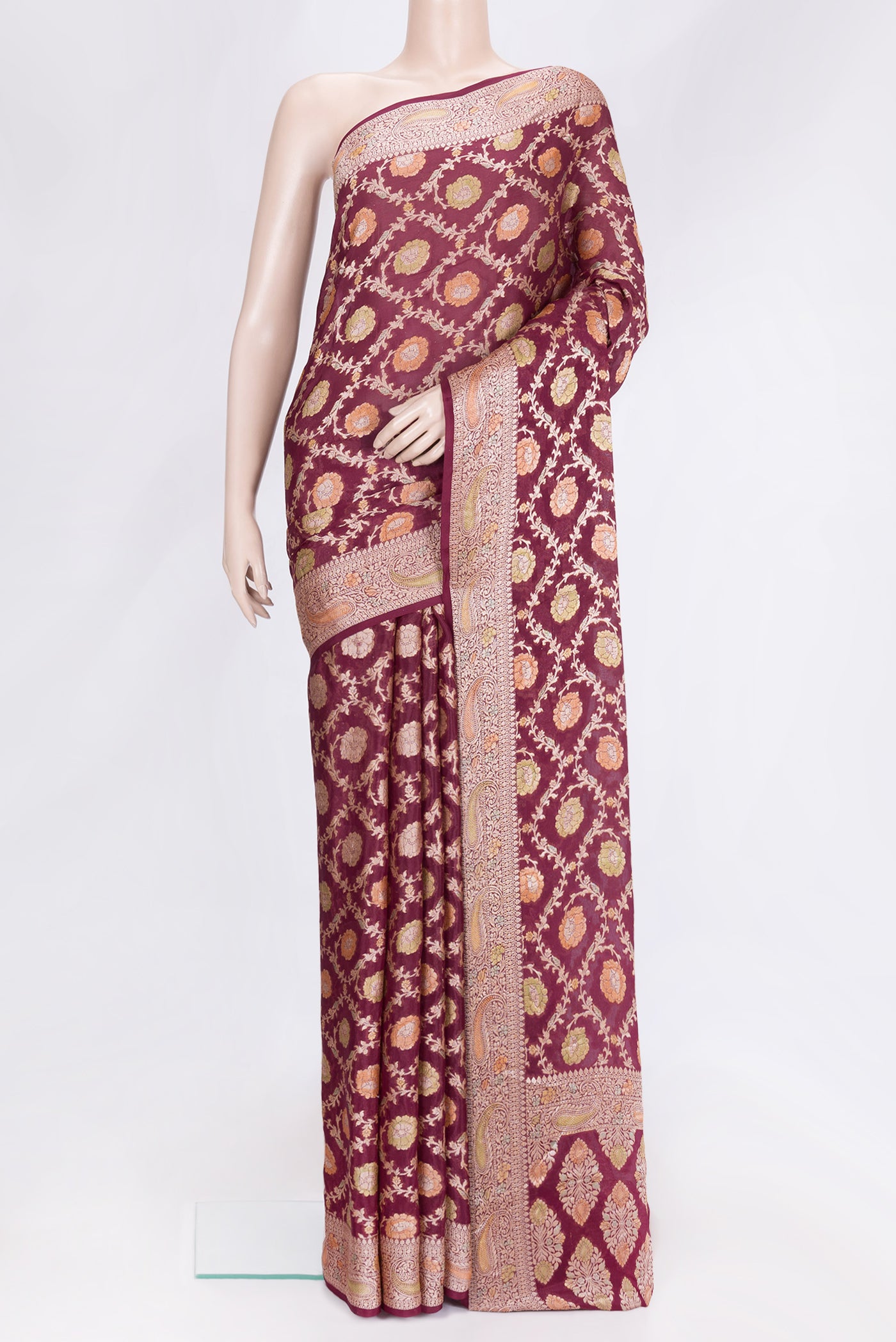 Maroon Dual Tone Mysore Georgette Saree with Zari Brocade on the body and Thread Border.  displayed on a mannequin