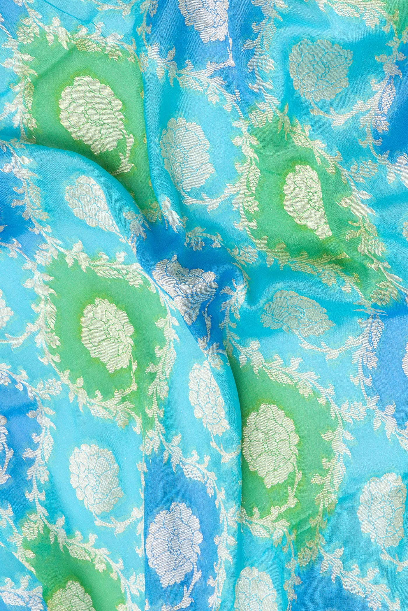 Close up of Sky Blue Banarasi Georgette Saree with Zari Brocade on the body and Zari Border.  displaying folds