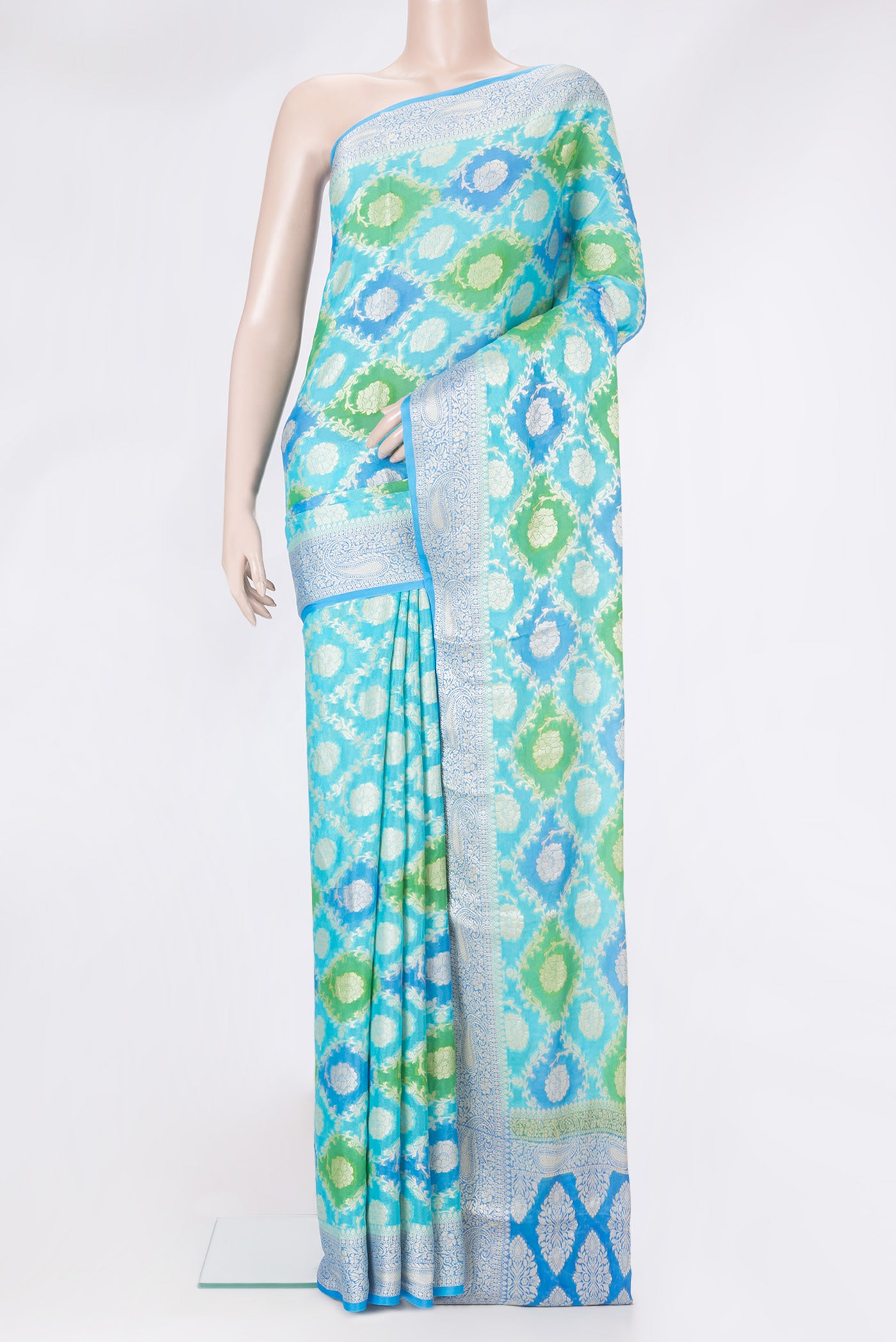 Sky Blue Banarasi Georgette Saree with Zari Brocade on the body and Zari Border.  displayed on a mannequin