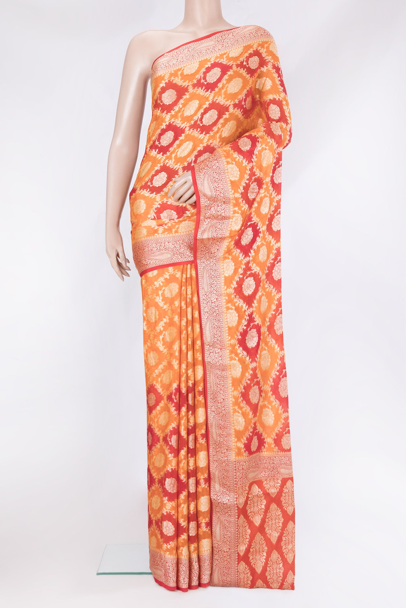 Orange Banarasi Georgette Saree with Zari Brocade on the body and Zari Border.  displayed on a mannequin