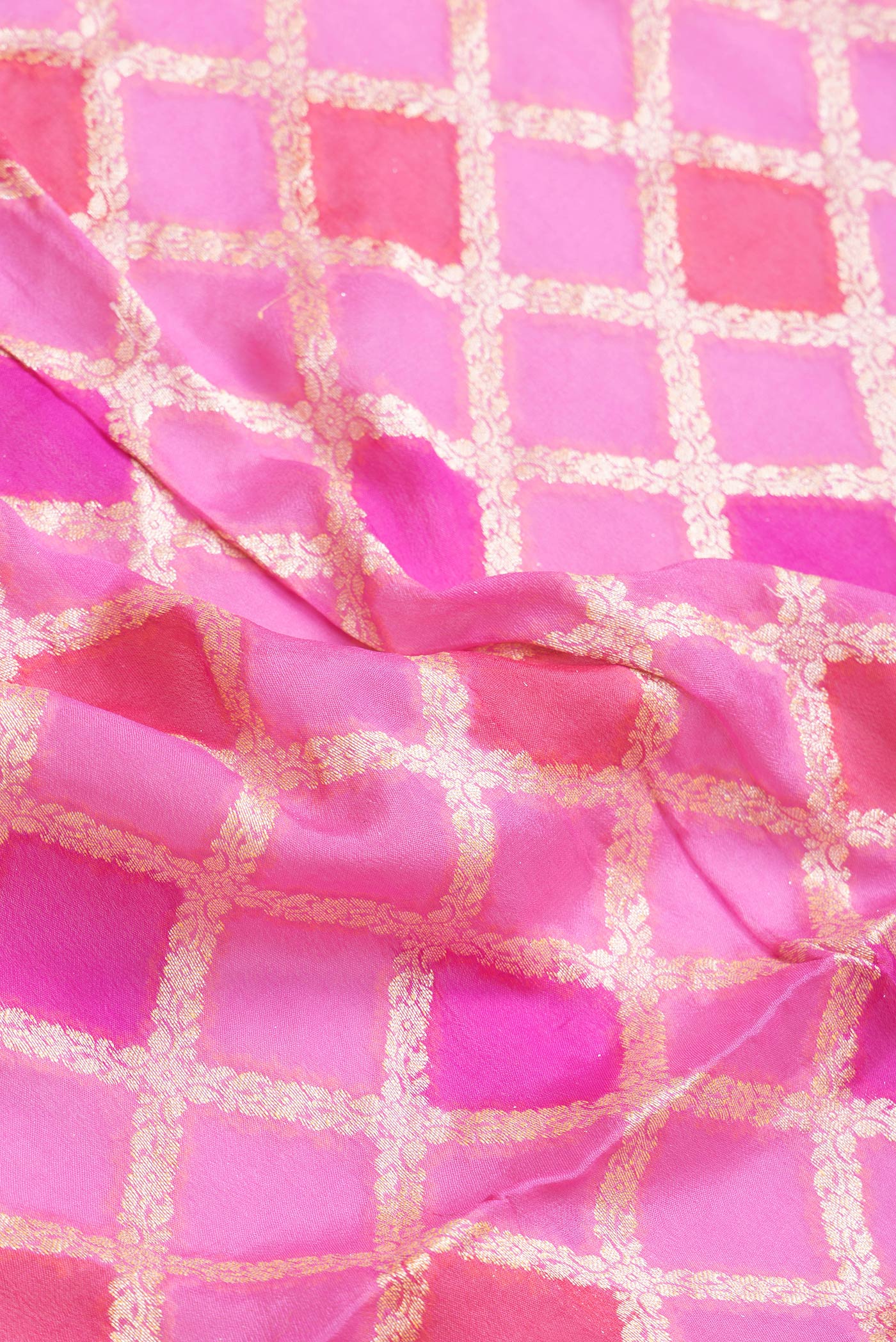 Close up of Pink Dual Tone Mysore Georgette Saree with Zari Brocade on the body and Thread Border.  displaying folds