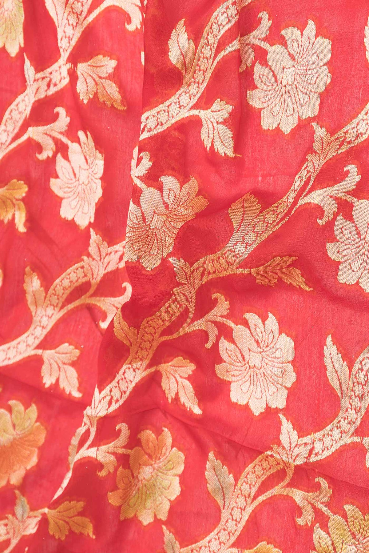 Close up of Red Dual Tone Georgette Saree with Zari Brocade on the body and Zari Border displaying folds