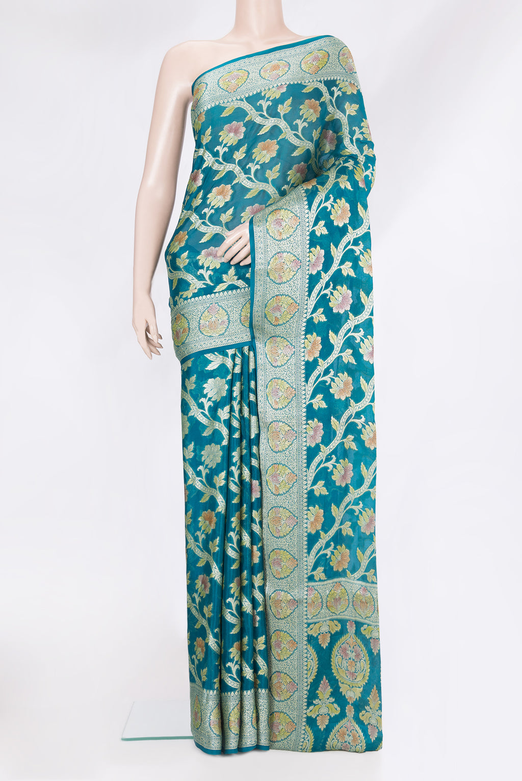 Peacock Blue Banarasi Georgette Saree with Zari And Thread Butta on the body and Zari Border.  displayed on a mannequin