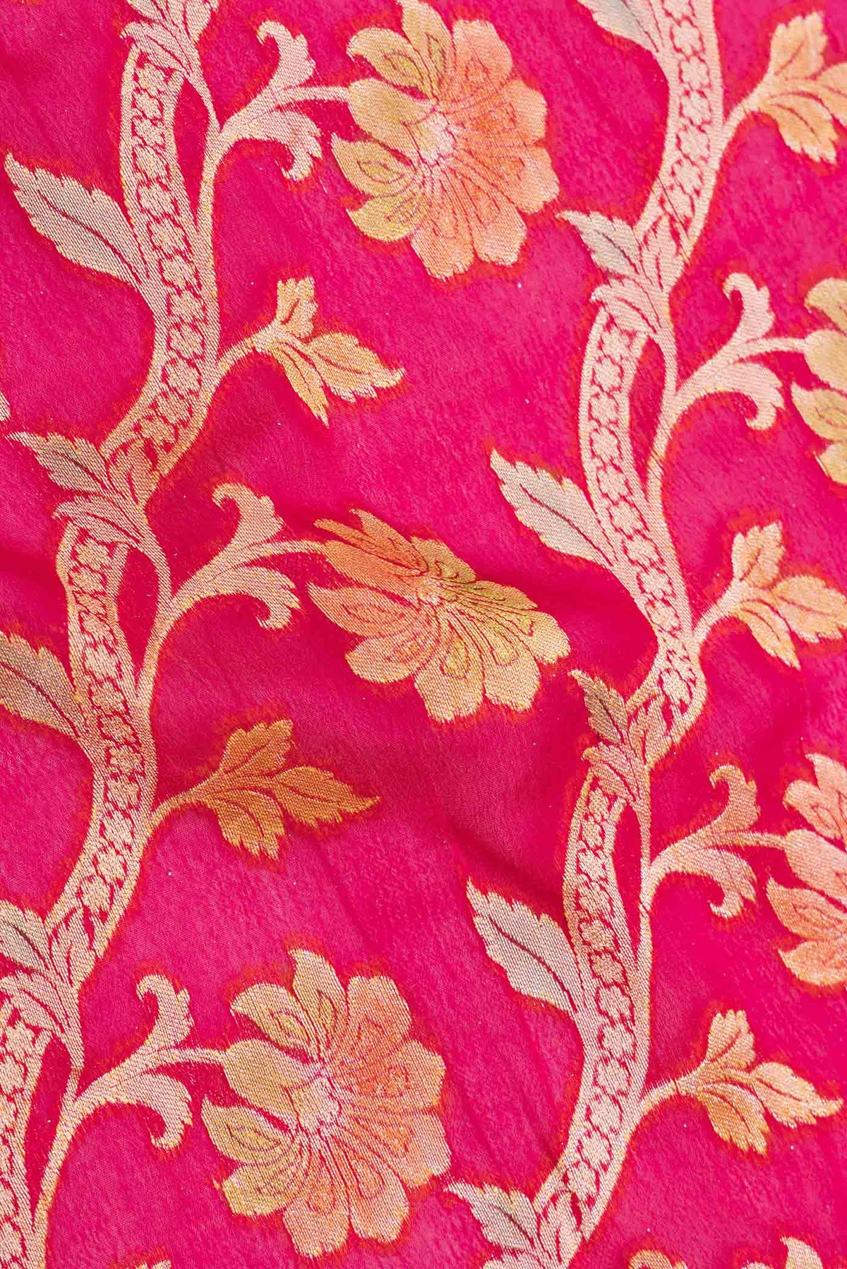 Close up of Pink Dual Tone Georgette Saree with Zari Brocade on the body and Zari Border displaying folds