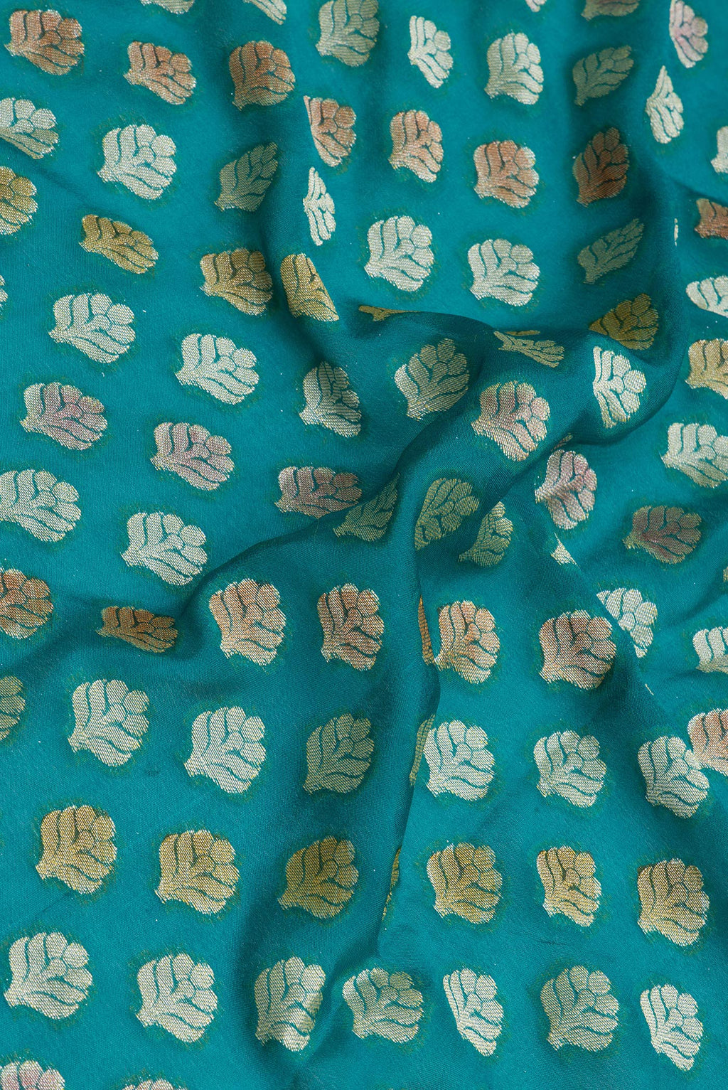 Close up of Peacock Blue Banarasi Georgette Saree with Zari Brocade on the body and Zari Border.  displaying folds
