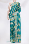 Peacock Blue Banarasi Georgette Saree with Zari Brocade on the body and Zari Border.  displayed on a mannequin