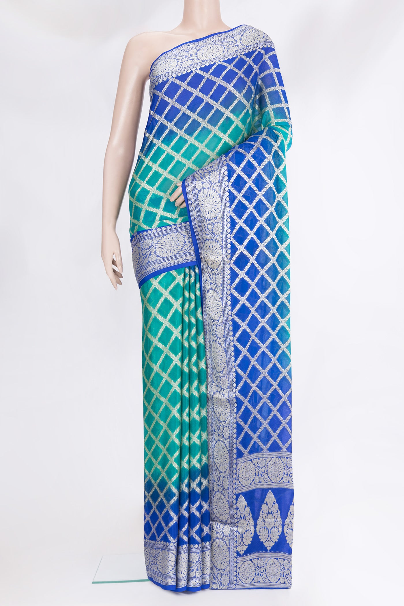 Peacock Blue Banarasi Georgette Saree with Zari Brocade on the body and Zari Border.  displayed on a mannequin