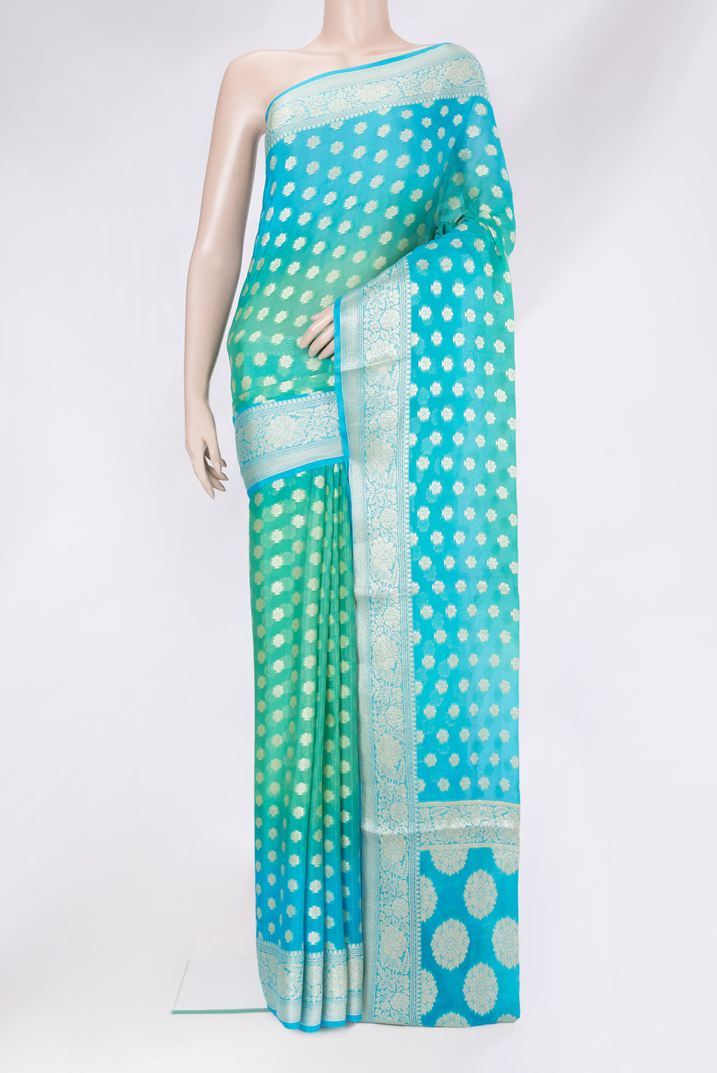 Sea Green Banarasi Georgette Saree with Zari Brocade on the body and Zari Border.  displayed on a mannequin