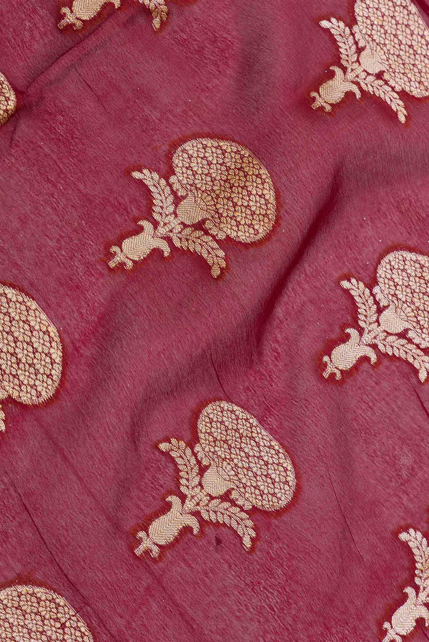 Close up of Maroon Dual Tone Georgette Saree with Zari Brocade on the body and Zari Border displaying folds