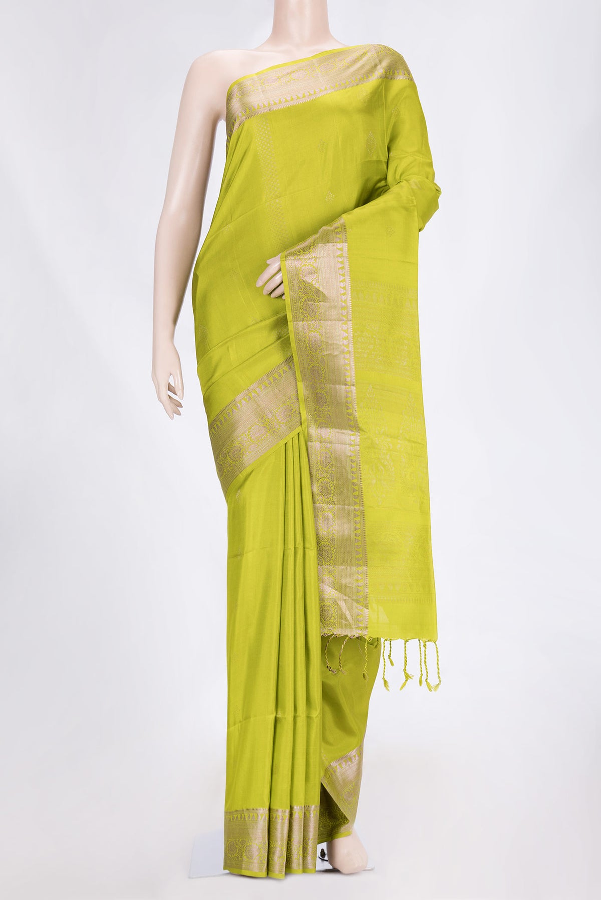 Parrot Green Dual Tone Soft Silk Saree with Zari Butta on the body and Thread Border.  displayed on a mannequin