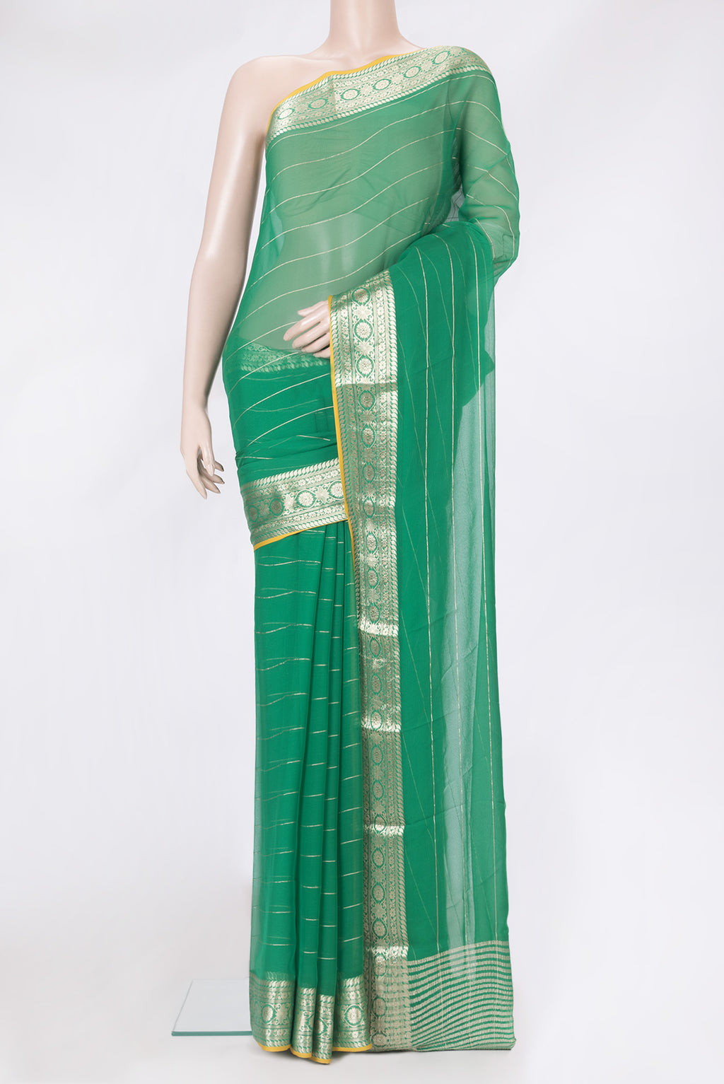 Green Mysore Chiffon Saree with Stripes on the body and Zari Border.  displayed on a mannequin