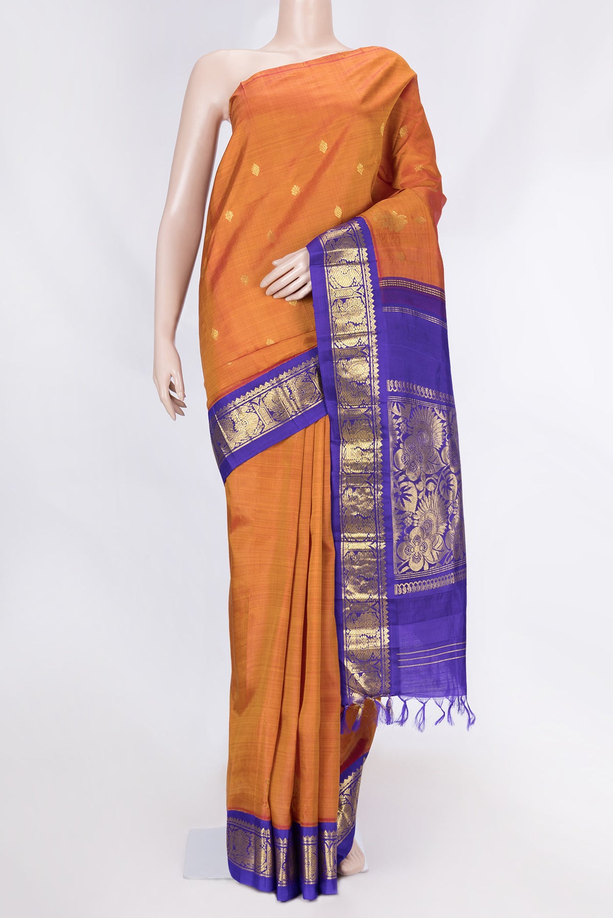 Mustard Dual Tone Kanchipuram Saree with Zari Butta on the body and Zari Border displayed on a mannequin