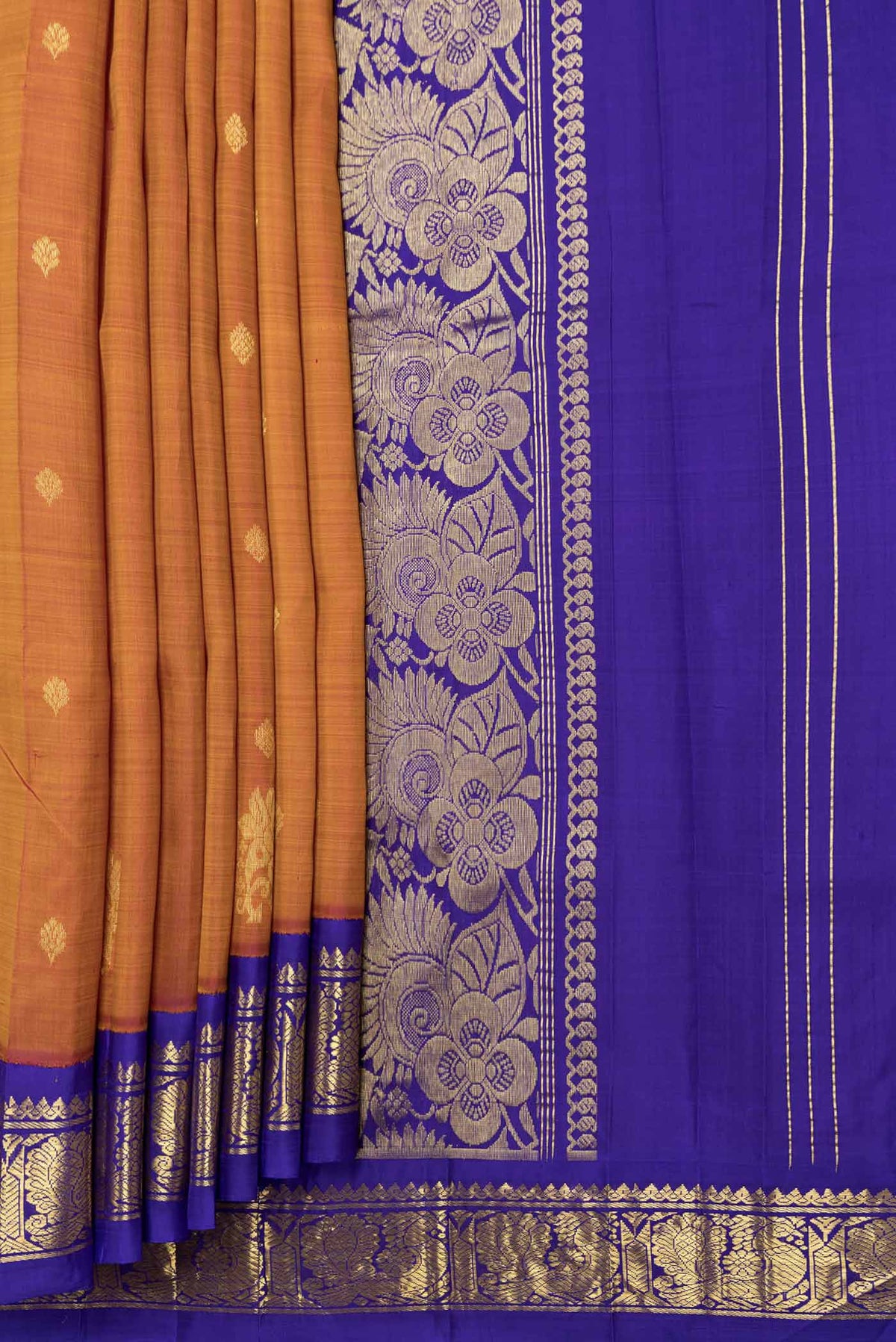 Pleats and pallu of Mustard Dual Tone Kanchipuram Saree with Zari Butta on the body and Zari Border