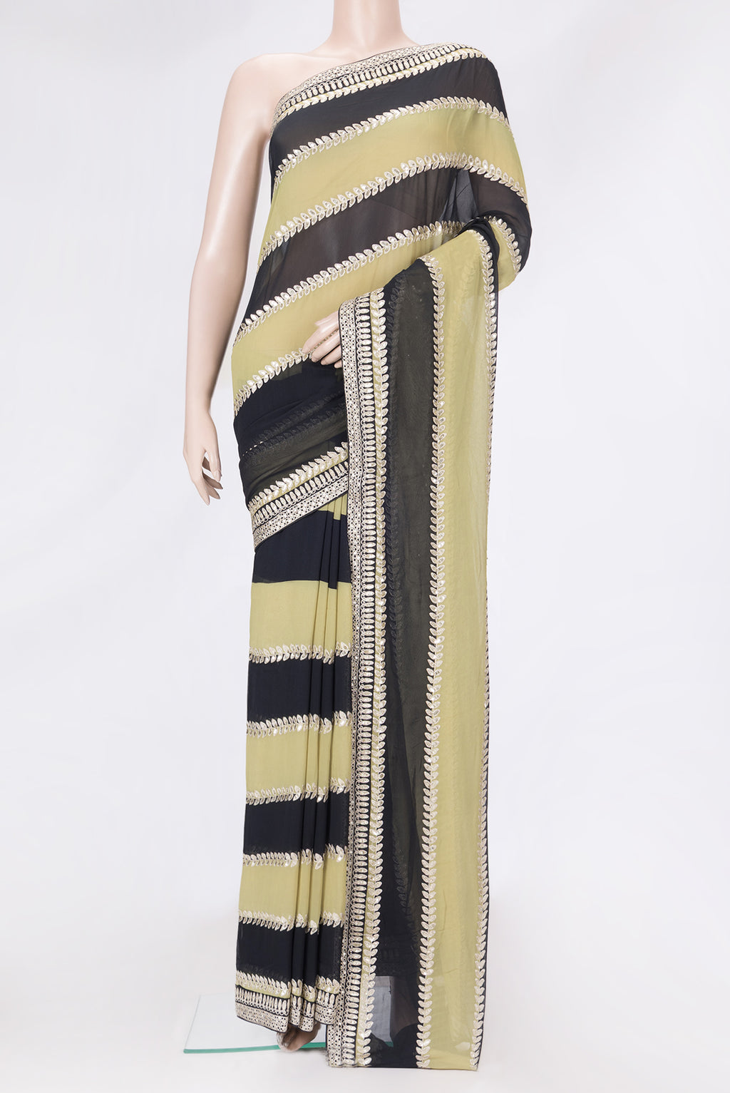 Green and Black Color Mysore Georgette Saree with Embroidery on the body and Embroidery Border.  displayed on a mannequin