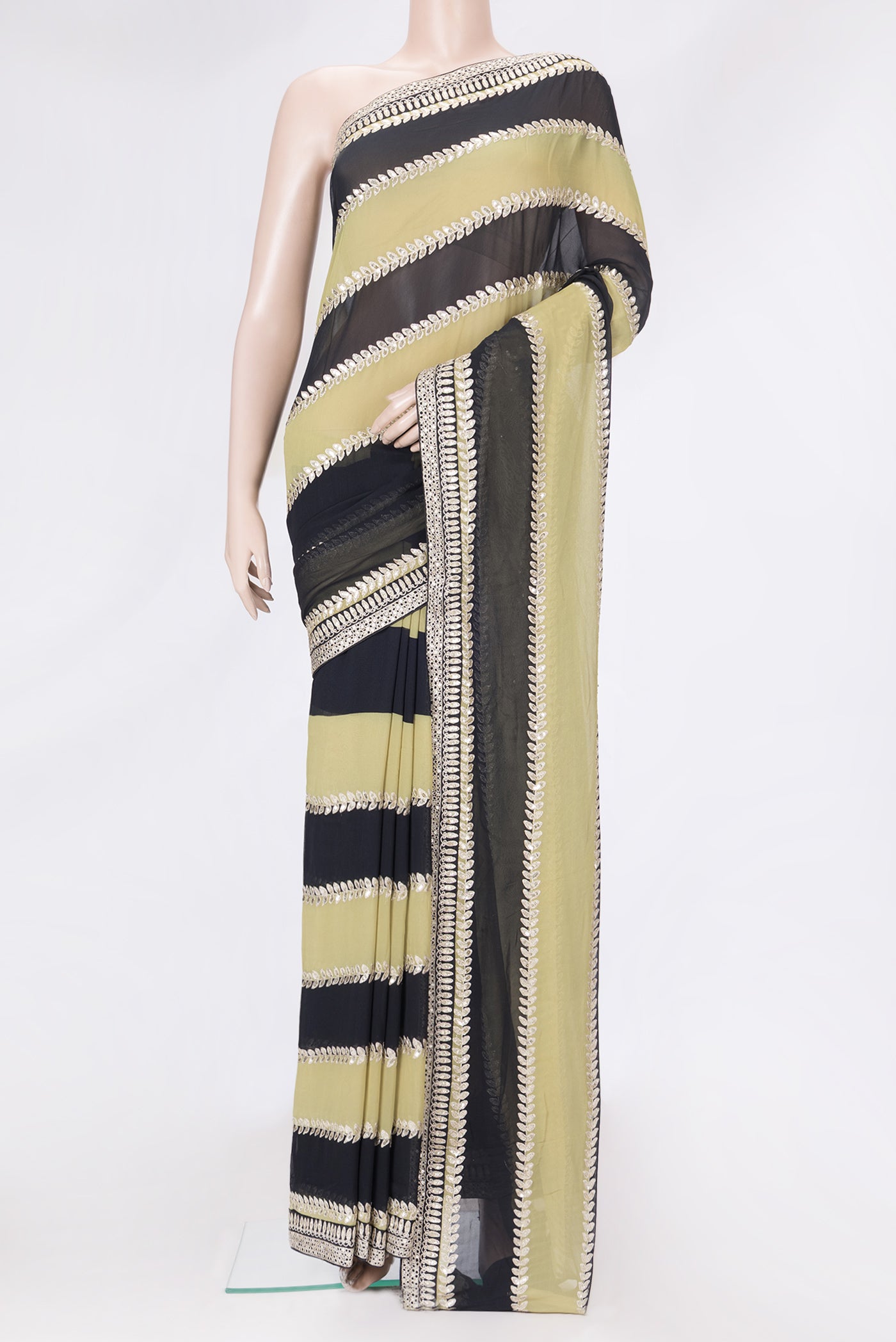 Green and Black Color Mysore Georgette Saree with Embroidery on the body and Embroidery Border.  displayed on a mannequin