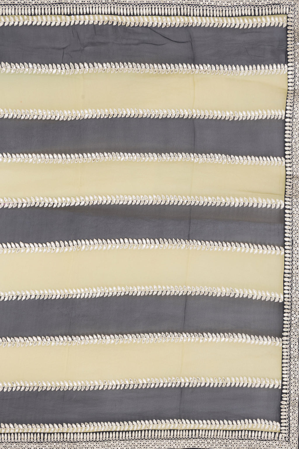 Close up image of the pallu of Green and Black Color Mysore Georgette Saree with Embroidery on the body and Embroidery Border. 