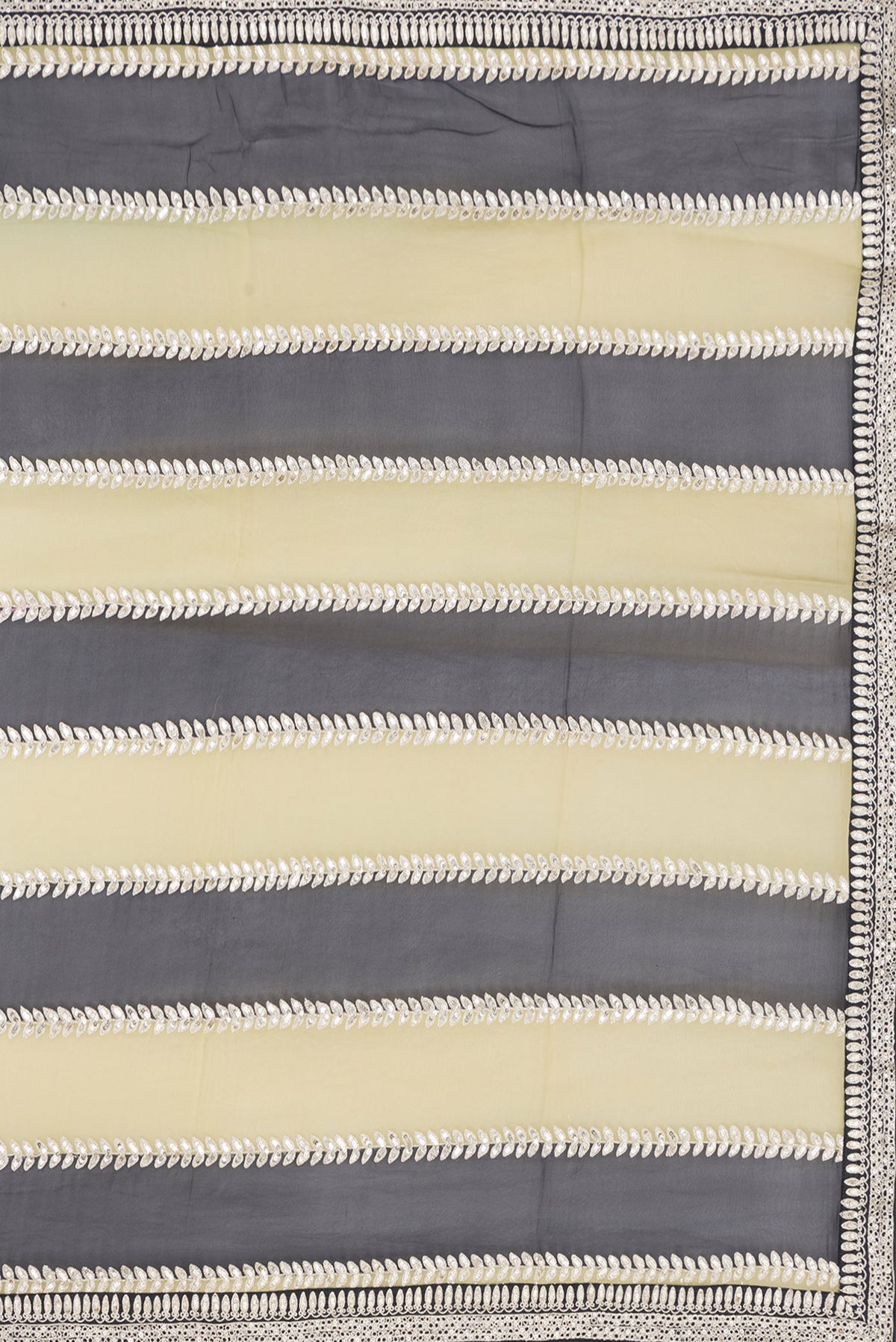 Close up image of the pallu of Green and Black Color Mysore Georgette Saree with Embroidery on the body and Embroidery Border. 