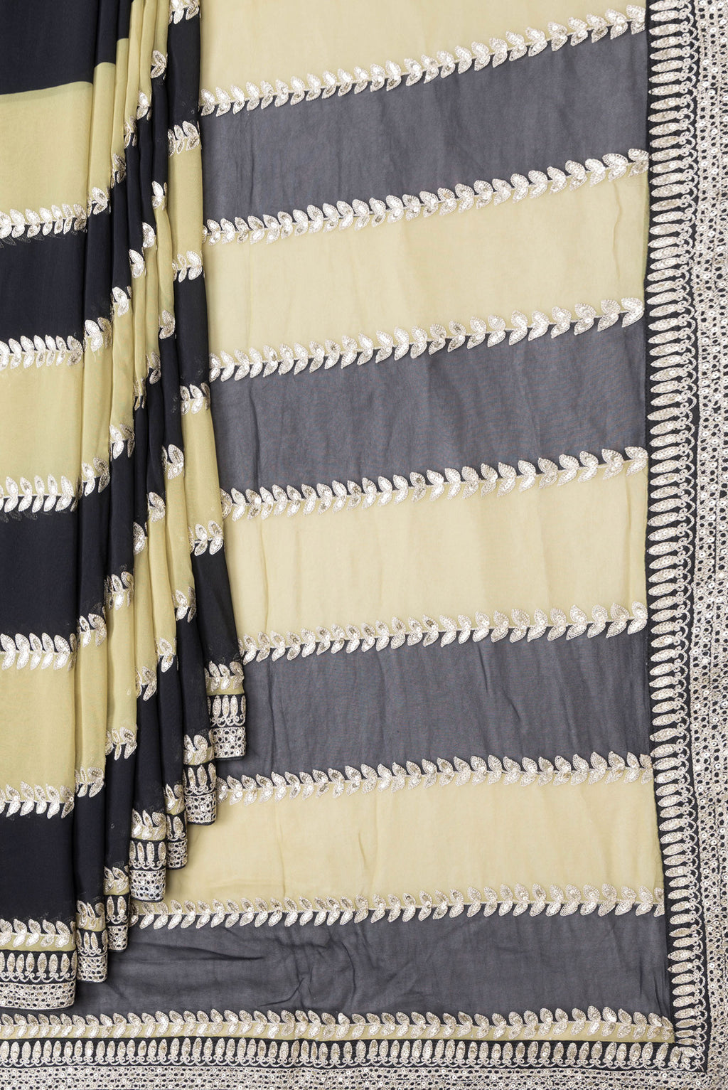 Pleats and pallu of Green and Black Color Mysore Georgette Saree with Embroidery on the body and Embroidery Border. 