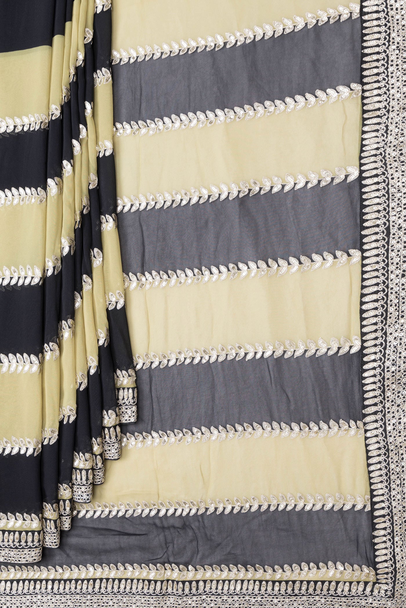 Pleats and pallu of Green and Black Color Mysore Georgette Saree with Embroidery on the body and Embroidery Border. 