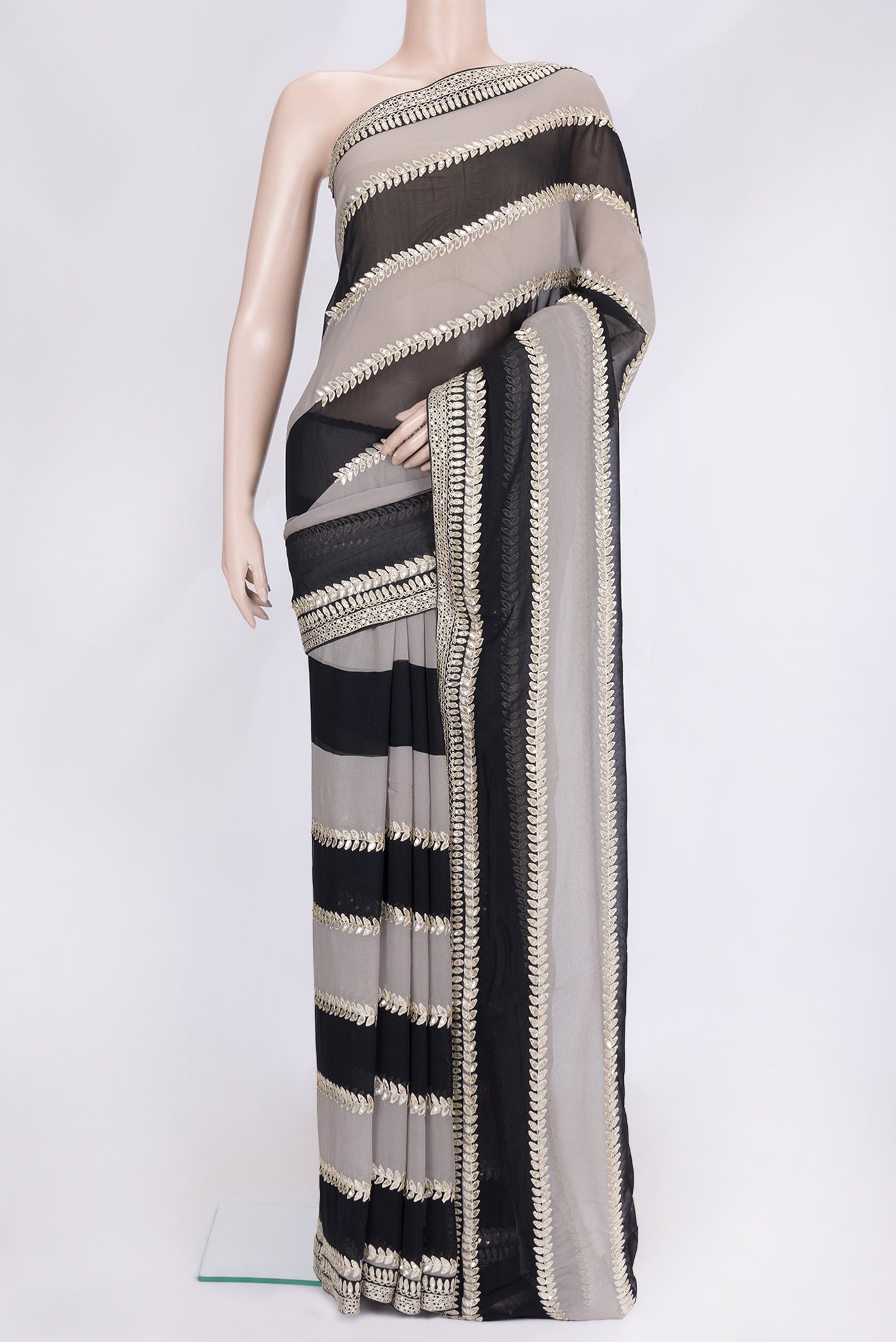 Black Dual Tone Mysore Georgette Saree with Embroidery on the body and Embroidery Border.  displayed on a mannequin