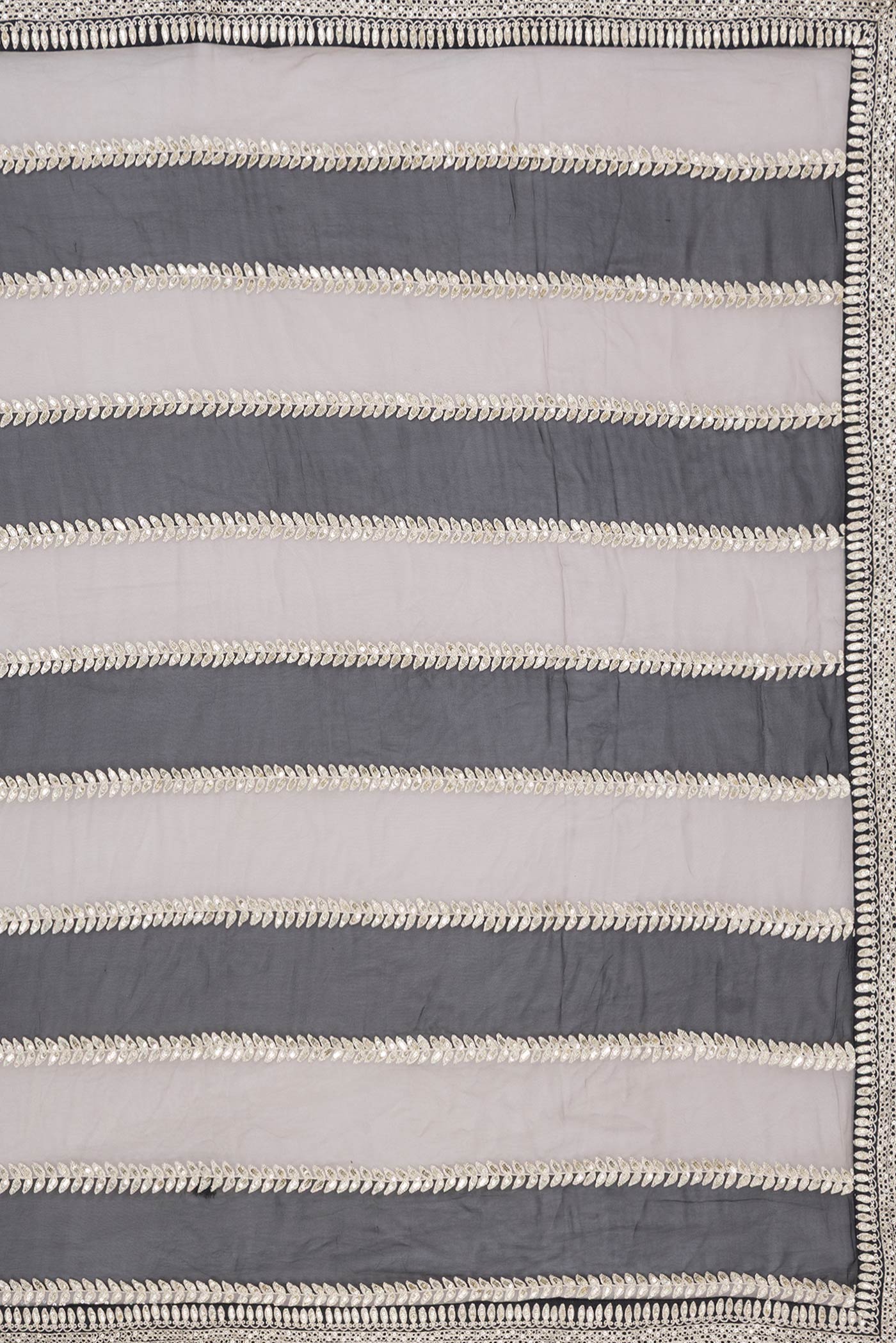Close up image of the pallu of Black Dual Tone Mysore Georgette Saree with Embroidery on the body and Embroidery Border. 