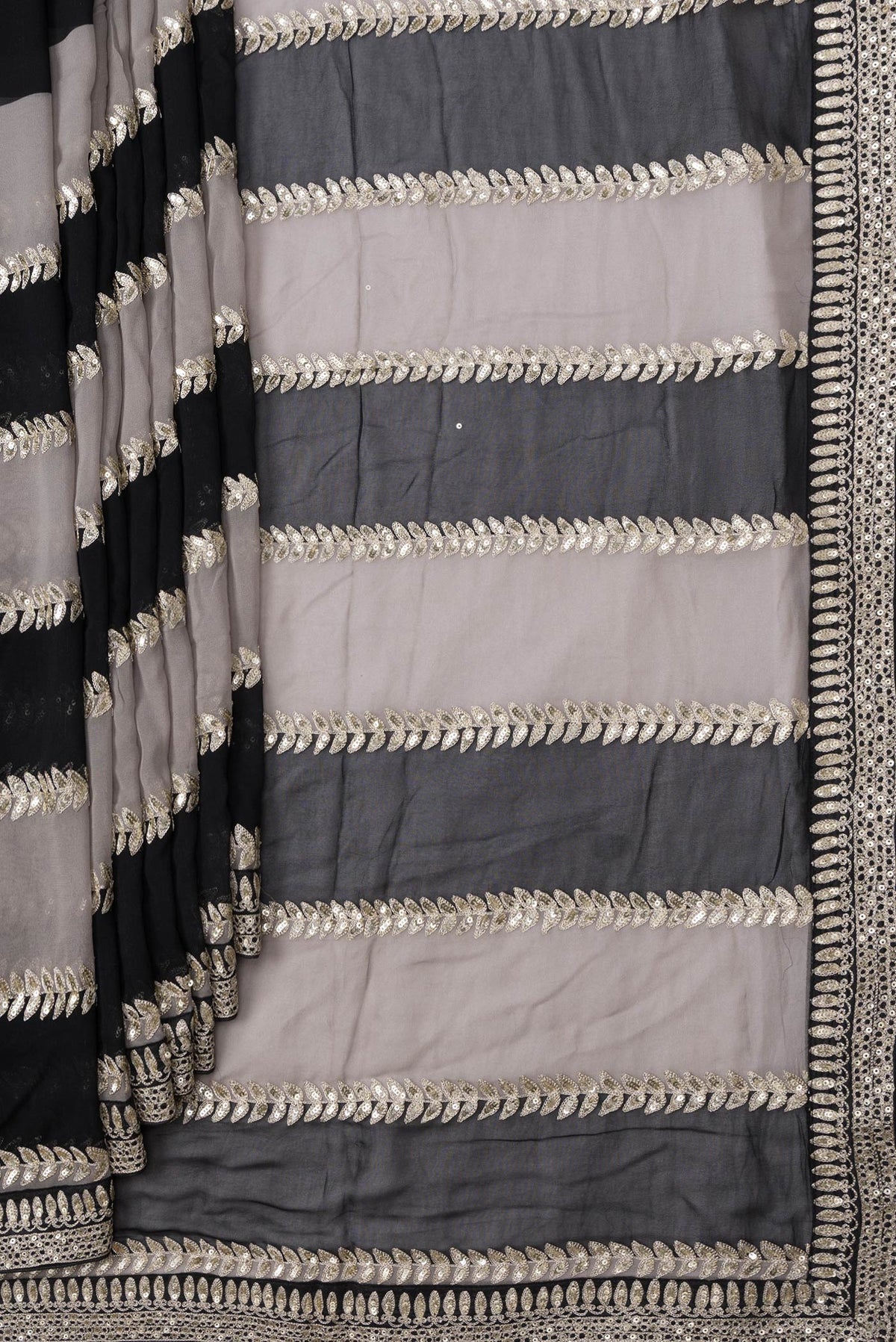 Pleats and pallu of Black Dual Tone Mysore Georgette Saree with Embroidery on the body and Embroidery Border. 