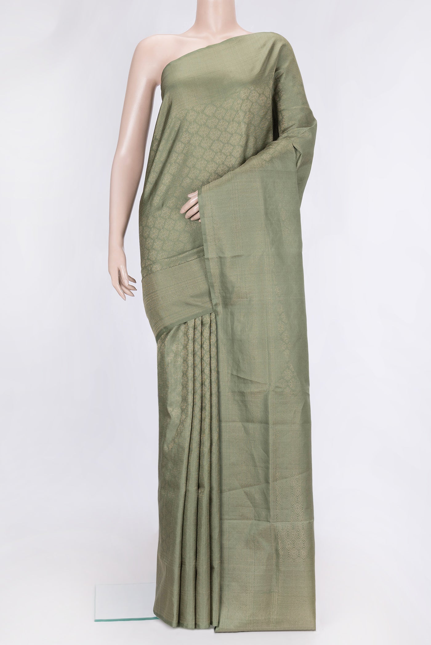 Pista Green Dual Tone Soft Silk Saree with Zari Brocade on the body and Zari Border.  displayed on a mannequin