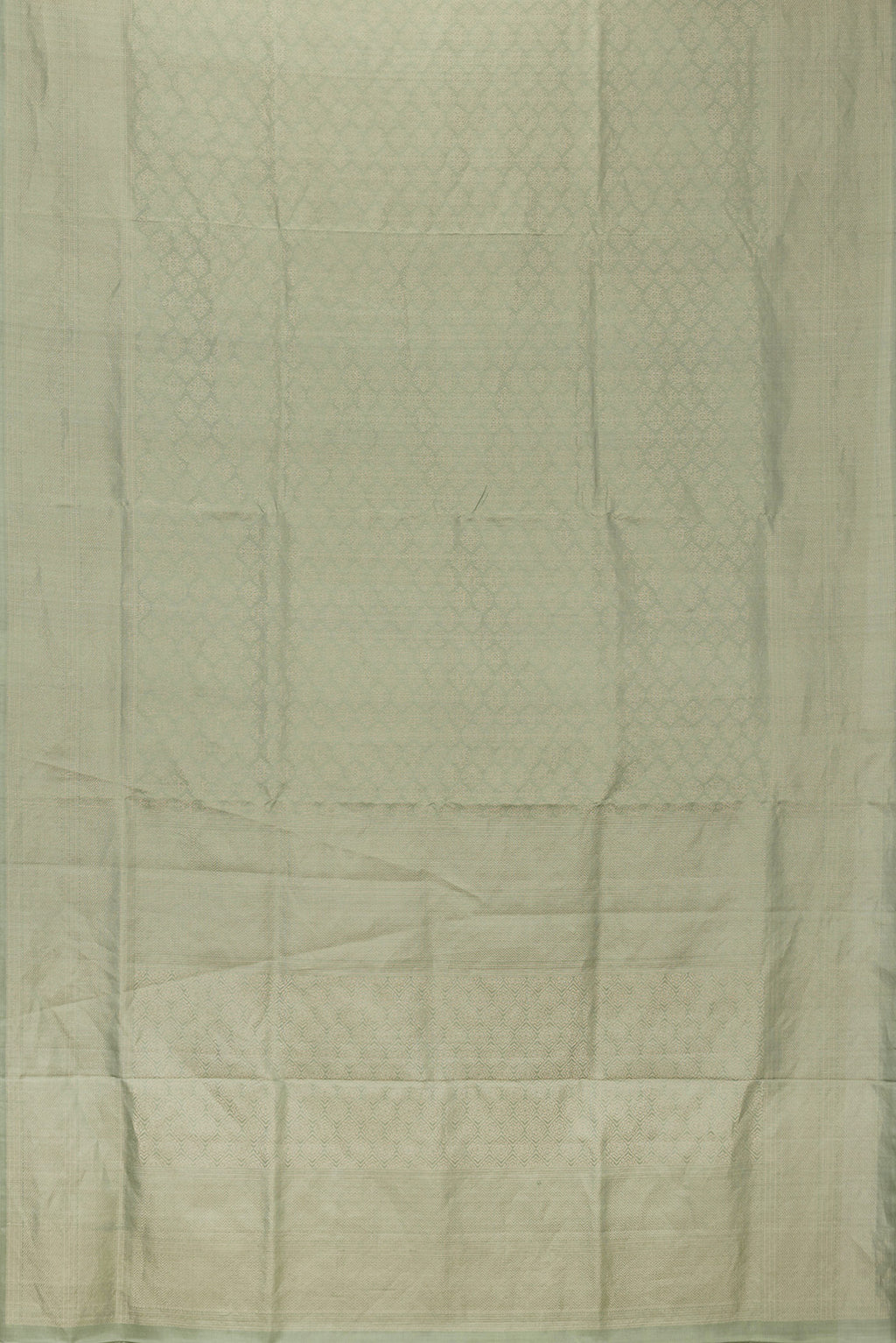 Flat view of Pista Green Dual Tone Soft Silk Saree with Zari Brocade on the body and Zari Border. 