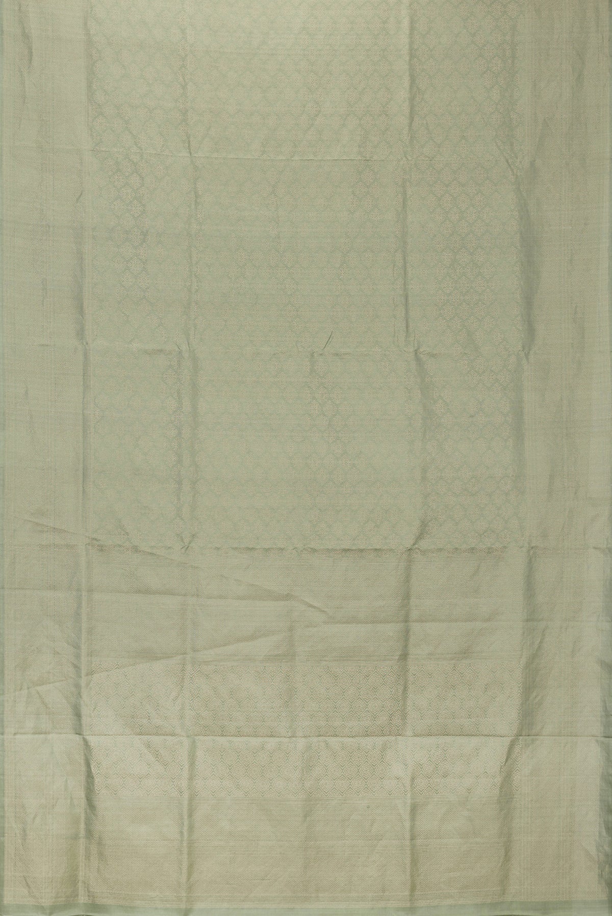 Flat view of Pista Green Dual Tone Soft Silk Saree with Zari Brocade on the body and Zari Border. 