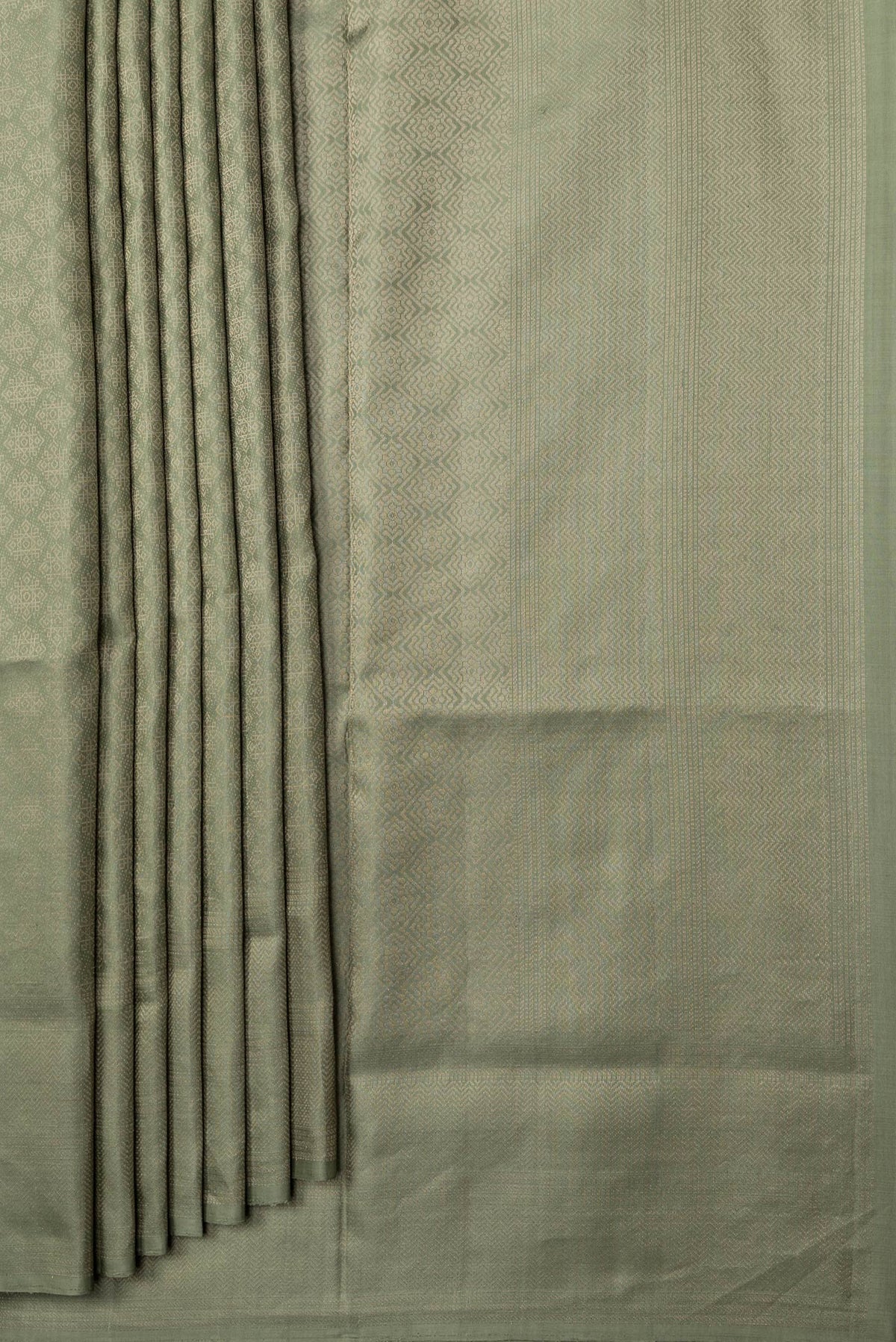 Pleats and pallu of Pista Green Dual Tone Soft Silk Saree with Zari Brocade on the body and Zari Border. 