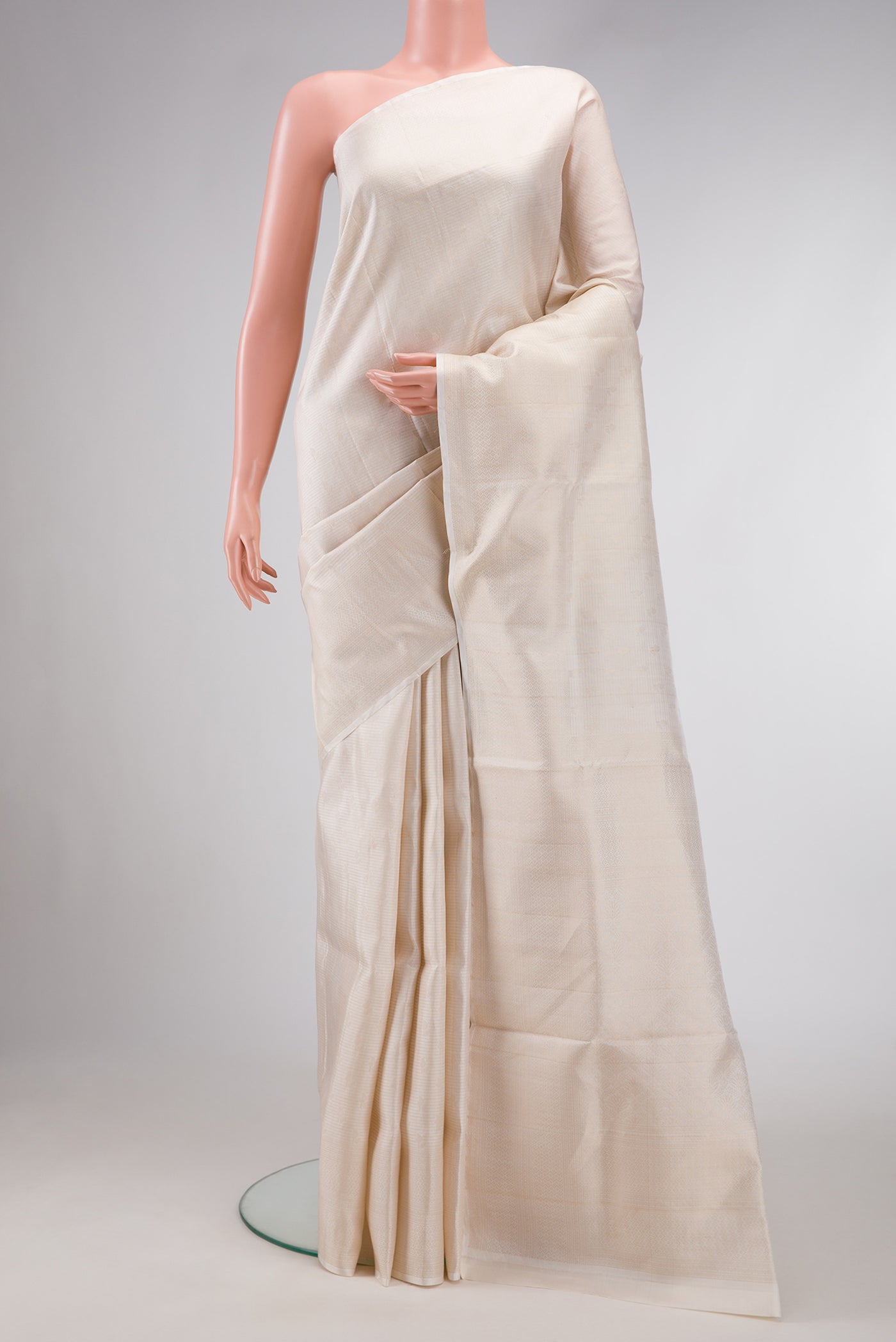 Beige Dual Tone Soft Silk Saree with Zari Brocade on the body and Fancy Border.  displayed on a mannequin