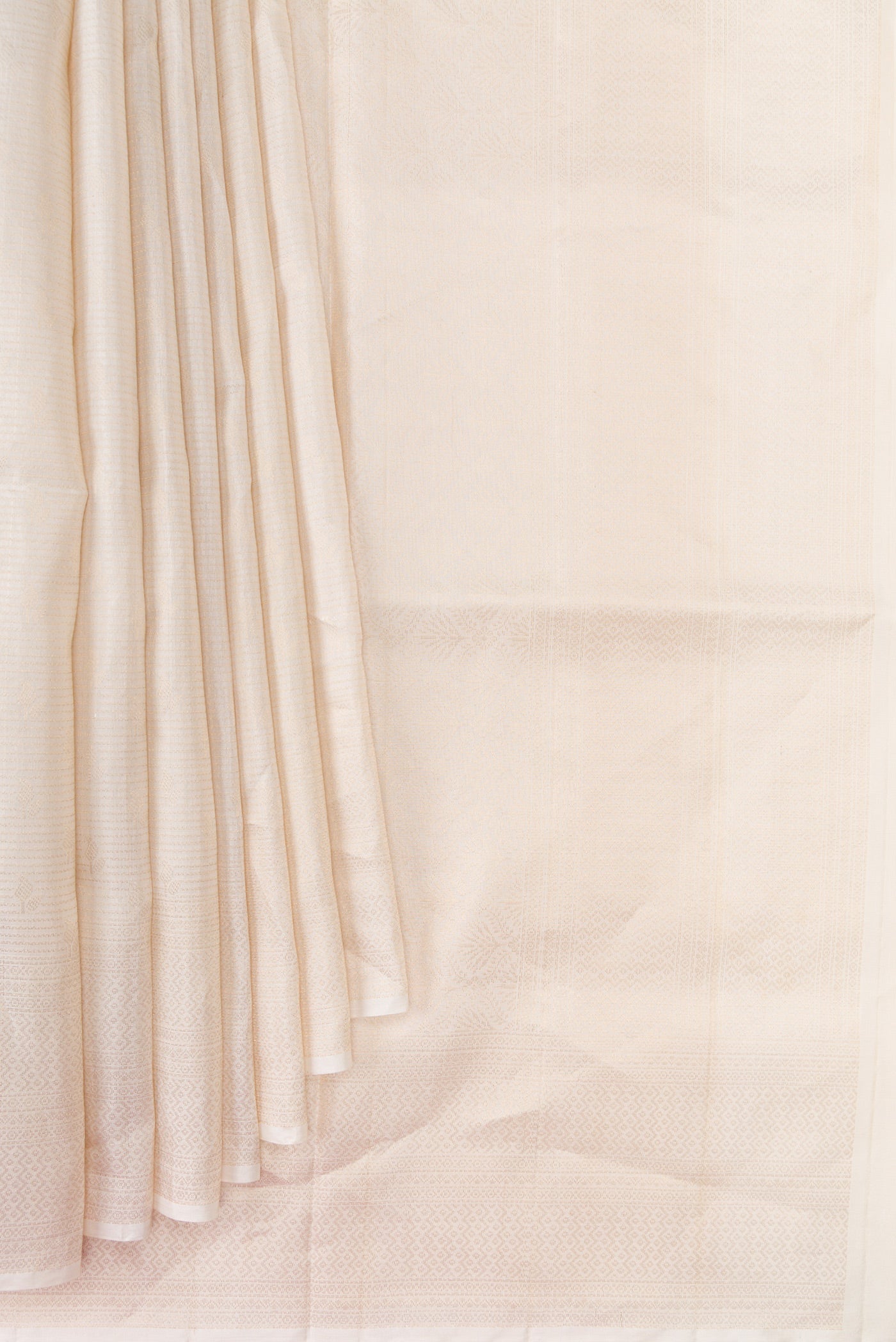 Pleats and pallu of Beige Dual Tone Soft Silk Saree with Zari Brocade on the body and Fancy Border. 