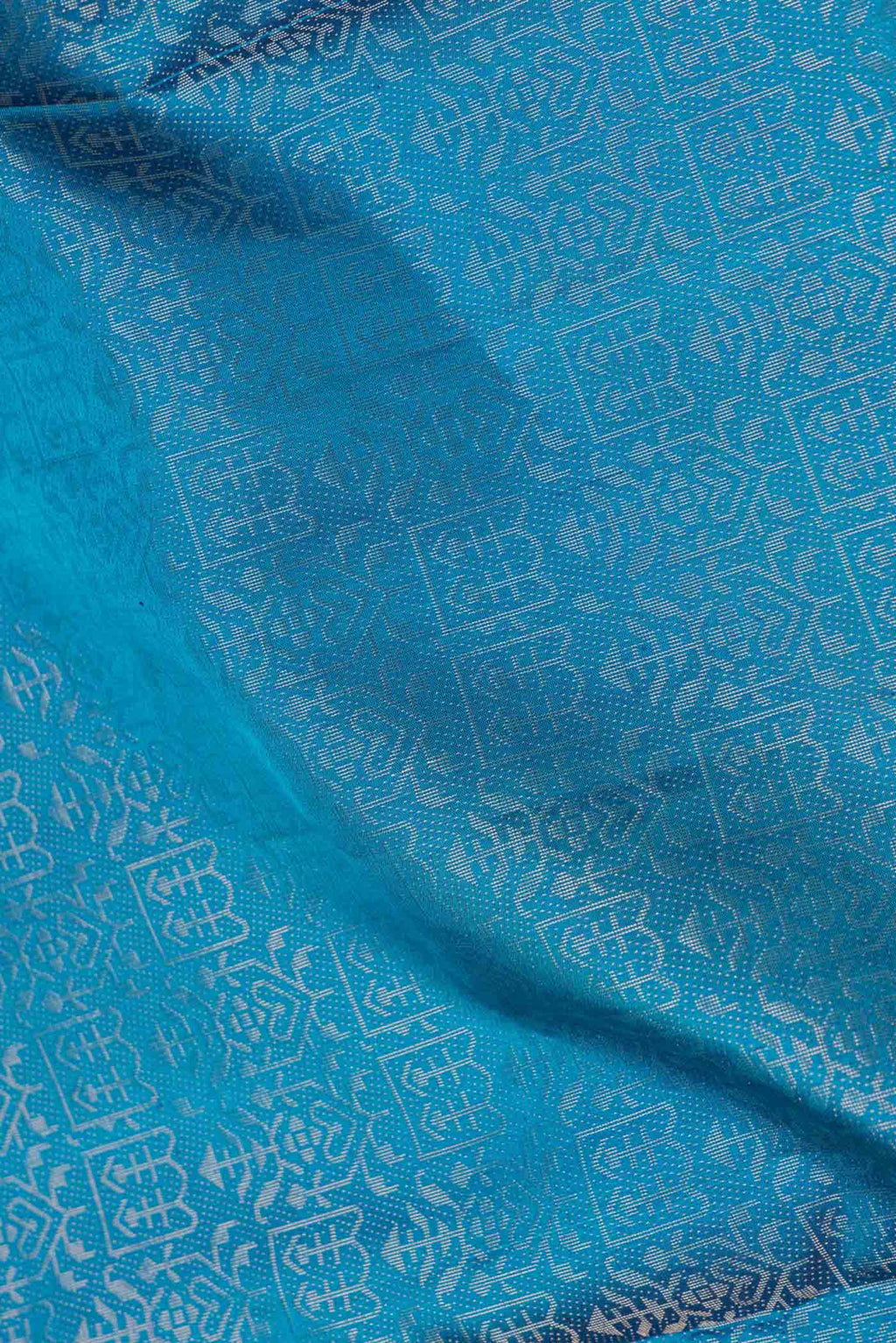 Close up of Peacock Blue Dual Tone Soft Silk Saree with Zari Brocade on the body and Zari Border.  displaying folds