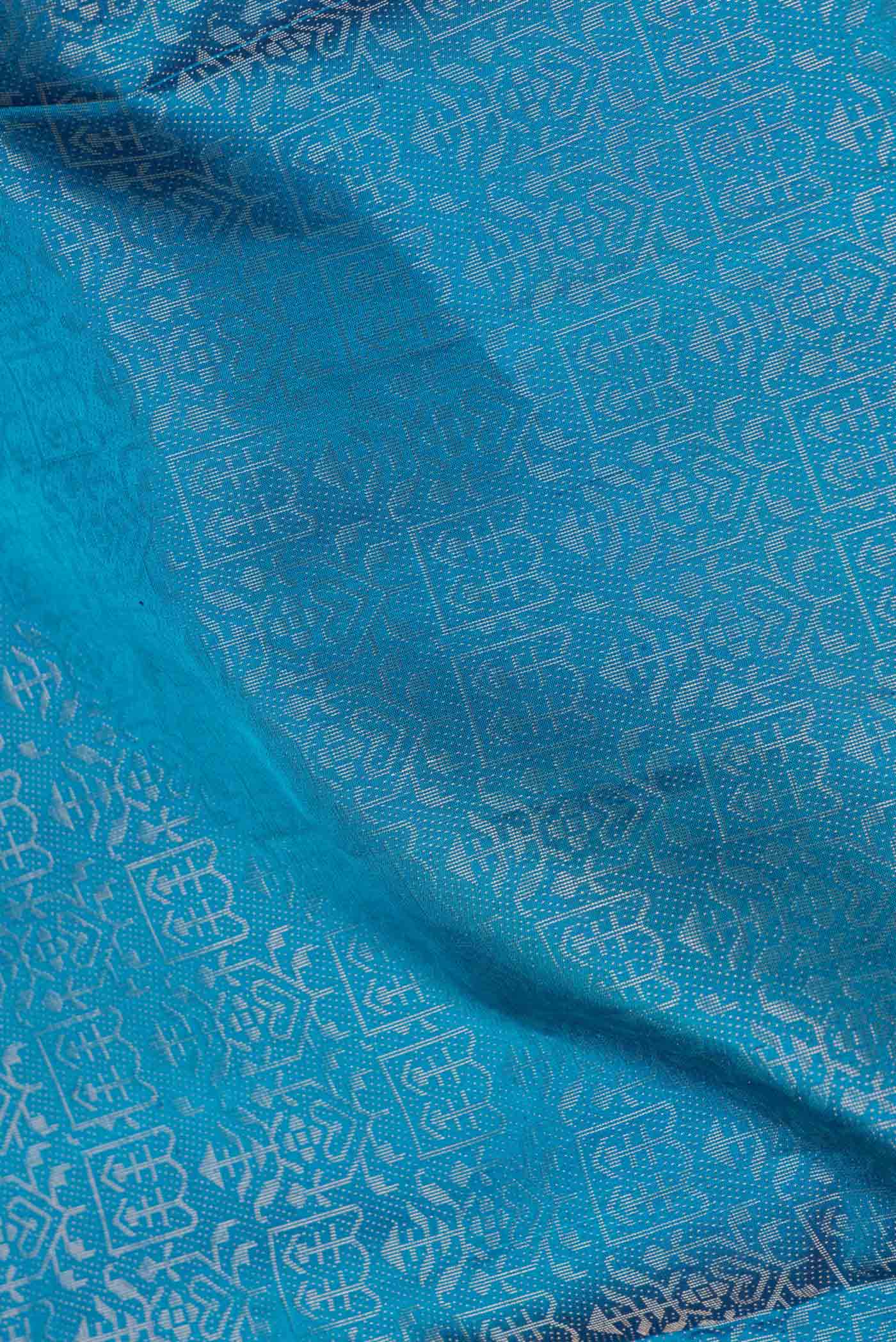 Close up of Peacock Blue Dual Tone Soft Silk Saree with Zari Brocade on the body and Zari Border.  displaying folds