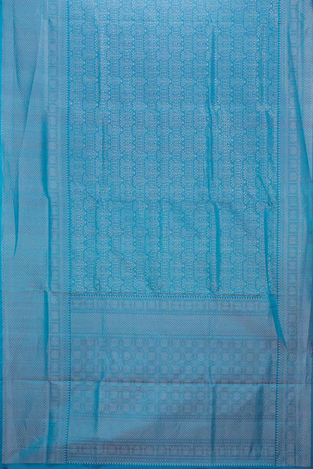 Flat view of Peacock Blue Dual Tone Soft Silk Saree with Zari Brocade on the body and Zari Border. 